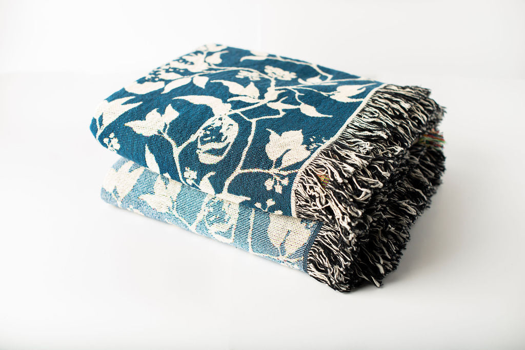 Wren bird and botanical woven throw blankets in Tidesong and Chambray colorways