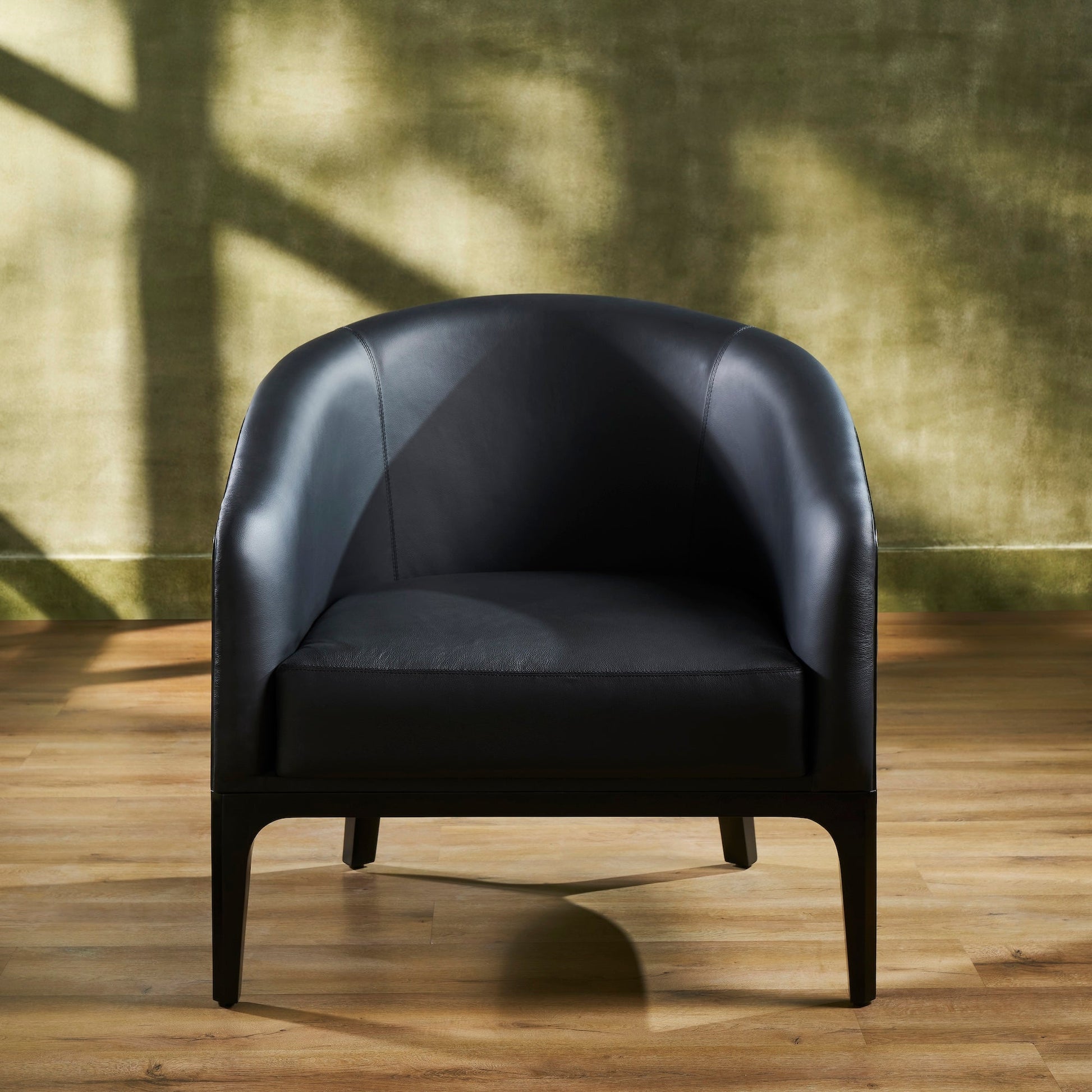 FN-5205-343329_4|Elegant black leather club chair with smooth upholstery and sturdy dark wooden legs, ideal for contemporary home office or lounge.
