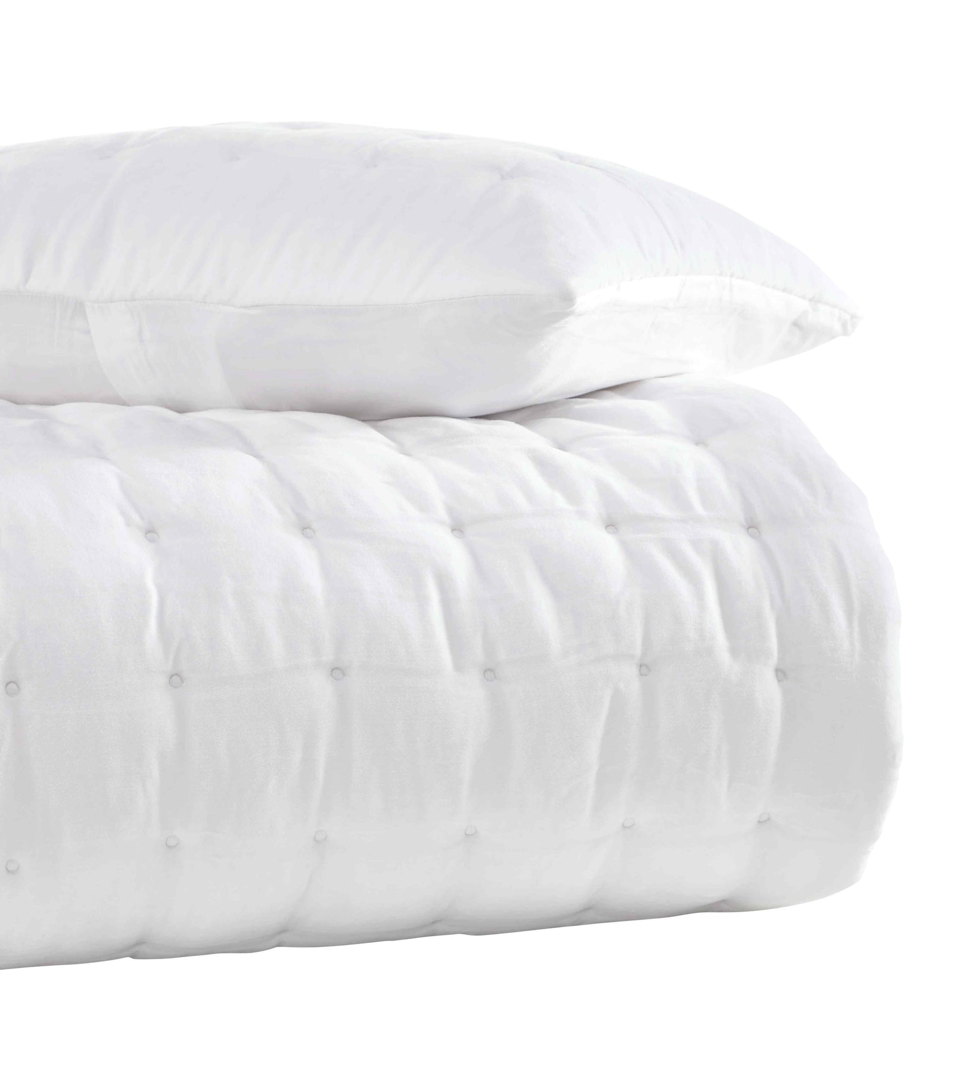 QT-353-9496_3|Stack of a white quilted comforter and matching pillow, highlighting plush texture and clean modern design. Soft bedding.
