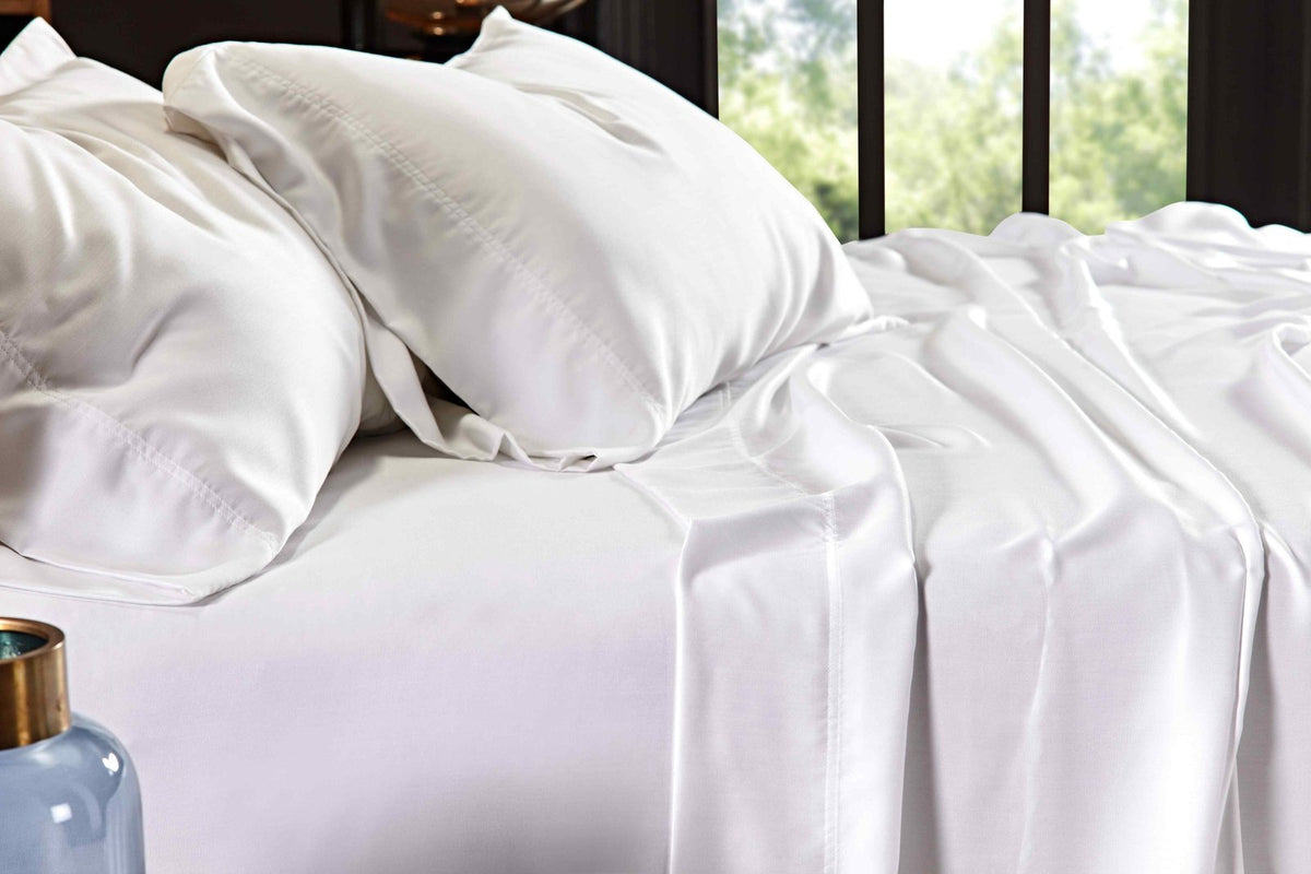 CSS-509-7284_4|Close-up of pristine white 100% Lyocell sheets, highlighting their luxurious, silky smooth, and breathable texture.
