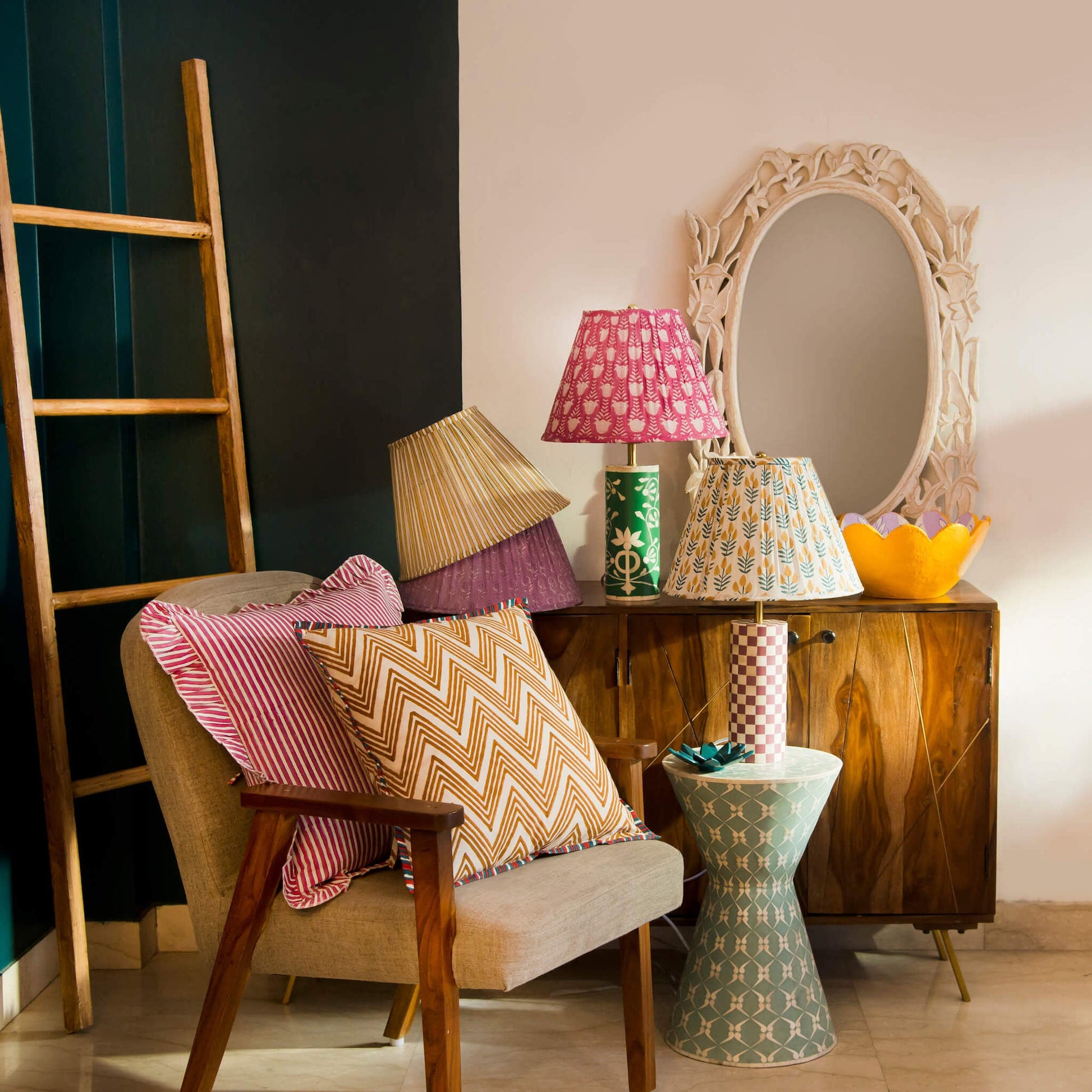 Decorative striped lamp shade paired with artisanal home accents and soft lighting.