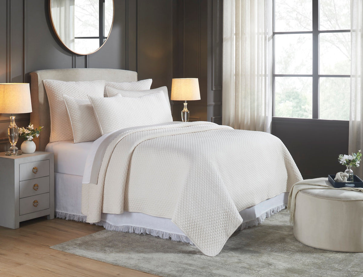 CL-265-11096_2|Stylish cream quilted coverlet draped on a bed, highlighting its subtle diamond pattern for a modern, comfortable bedroom.