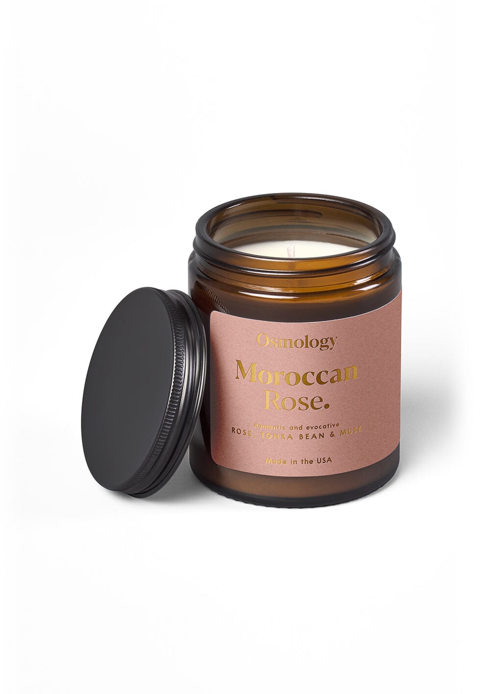 Osmology Moroccan Rose jar candle with open lid on yellow-cream background