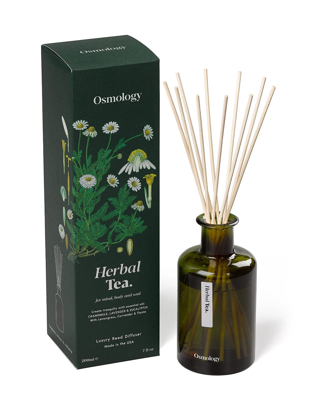 Osmology Herbal Tea reed diffuser in dark green glass next to product packaging on an orange-cream background