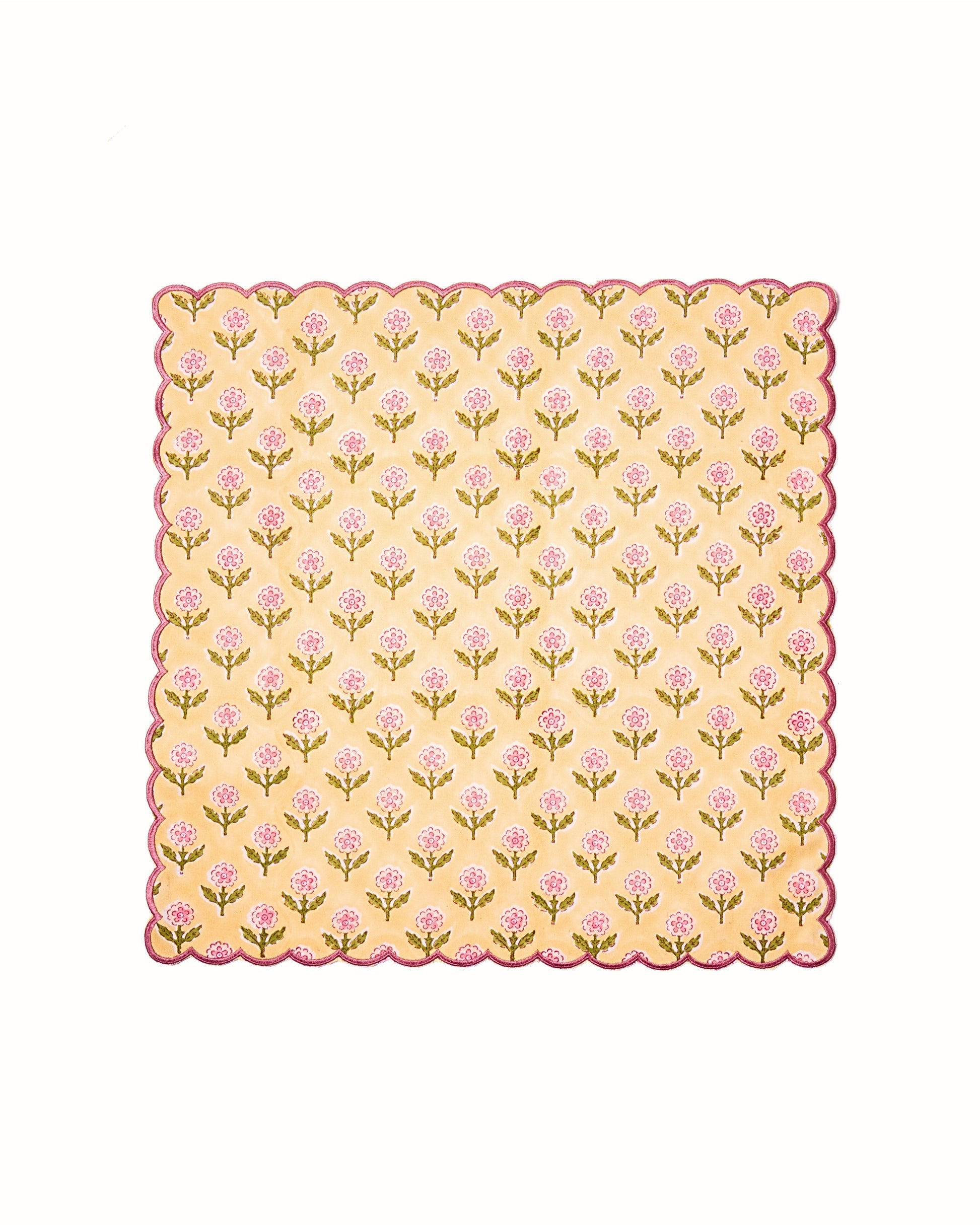 Inner Child single yellow scallop napkin with pink flower pattern