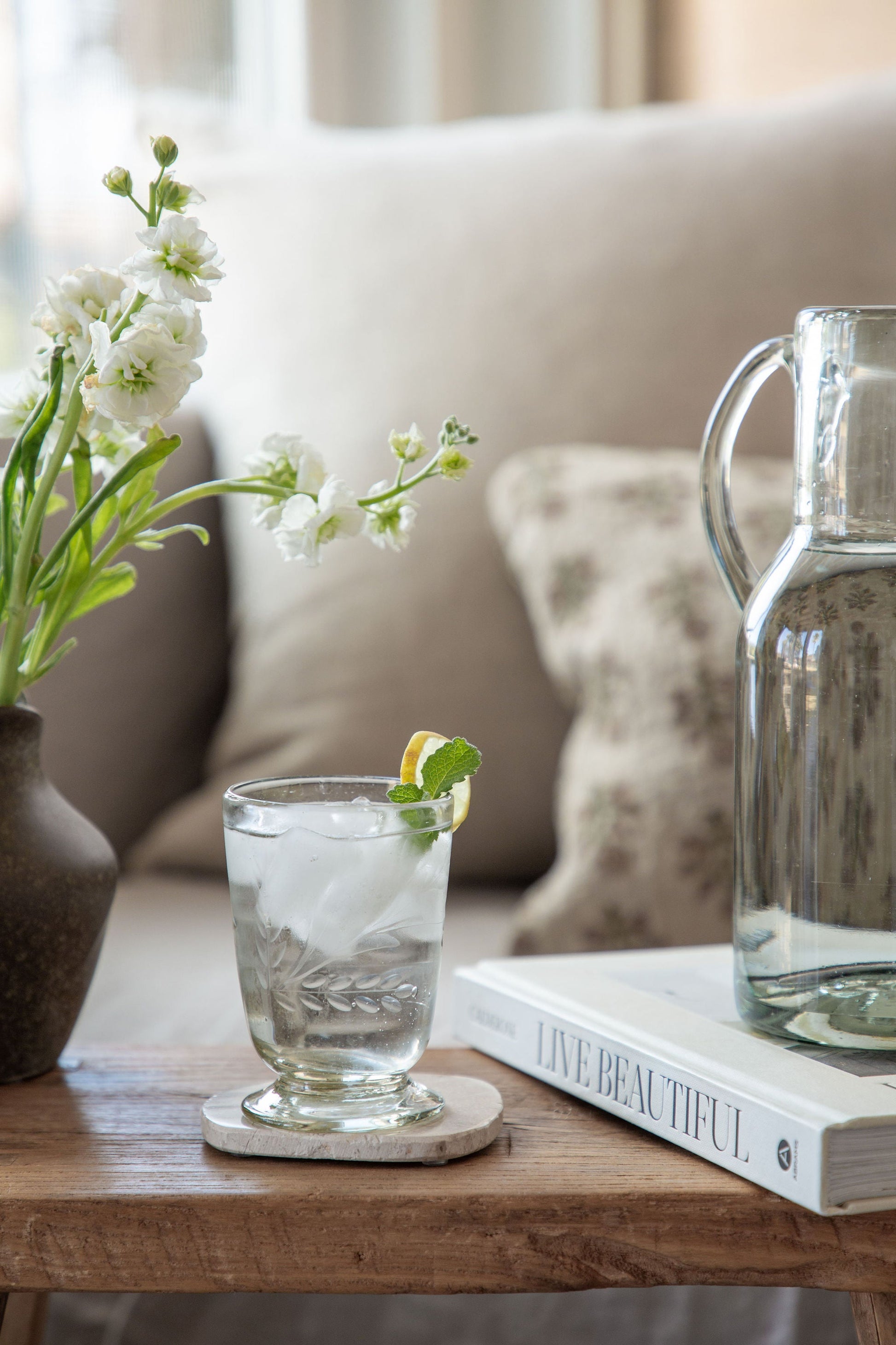 Handblown recycled glass footed vessel with hand-etched floral pattern