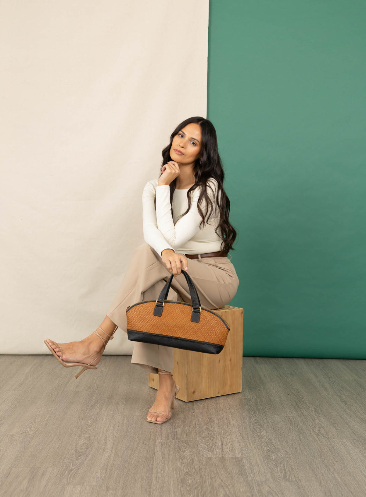 Satchel bowler bag spring collection model sitting.
