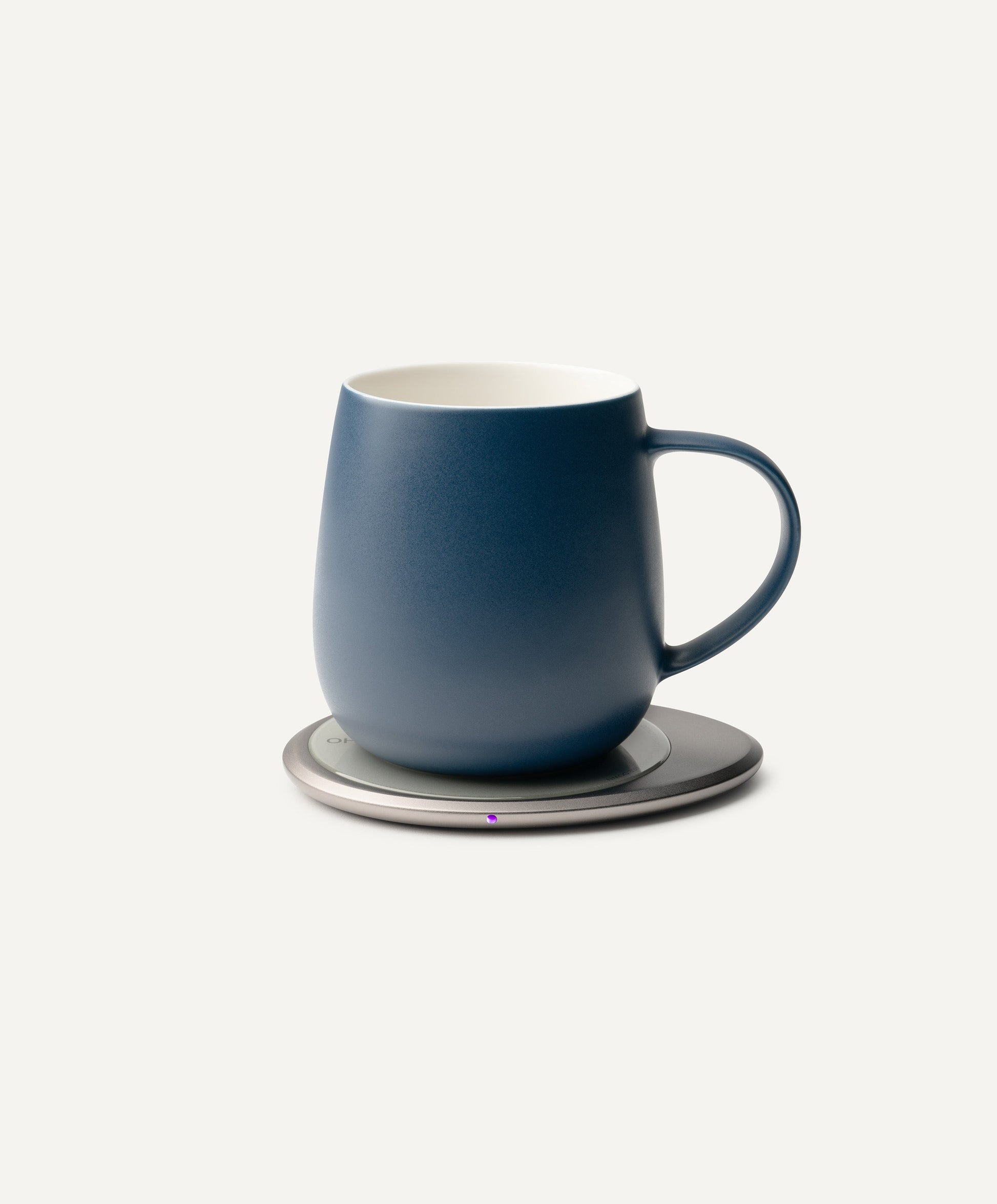 Ui 3 Self-Heating Ceramic Mug 12 fl oz / 355 mL in Deep Navy on Ohom Charging Pad 3