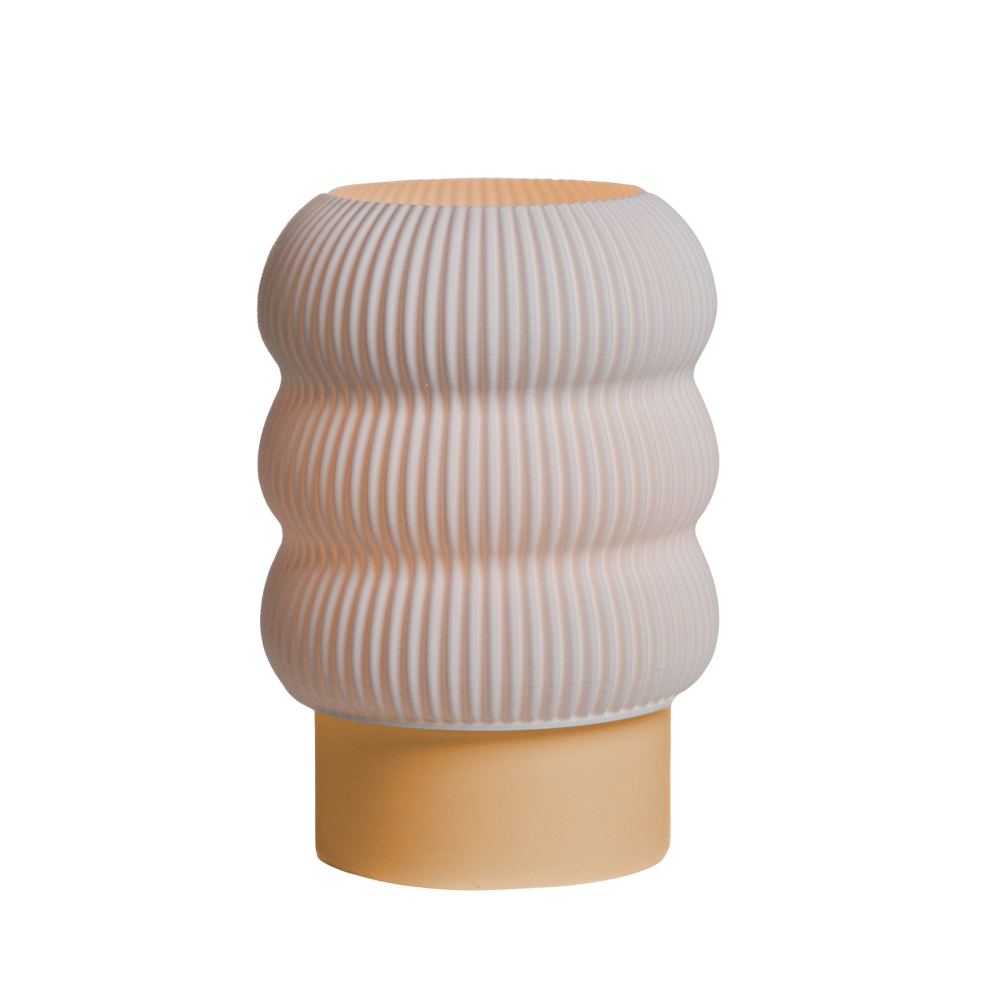 Lola Lamp in Peach – warm peach-toned table lamp with smooth, rounded form
Rounded matte shade and curved base – Peach Lola Lamp
Soft geometric table lamp in Peach for joyful styling