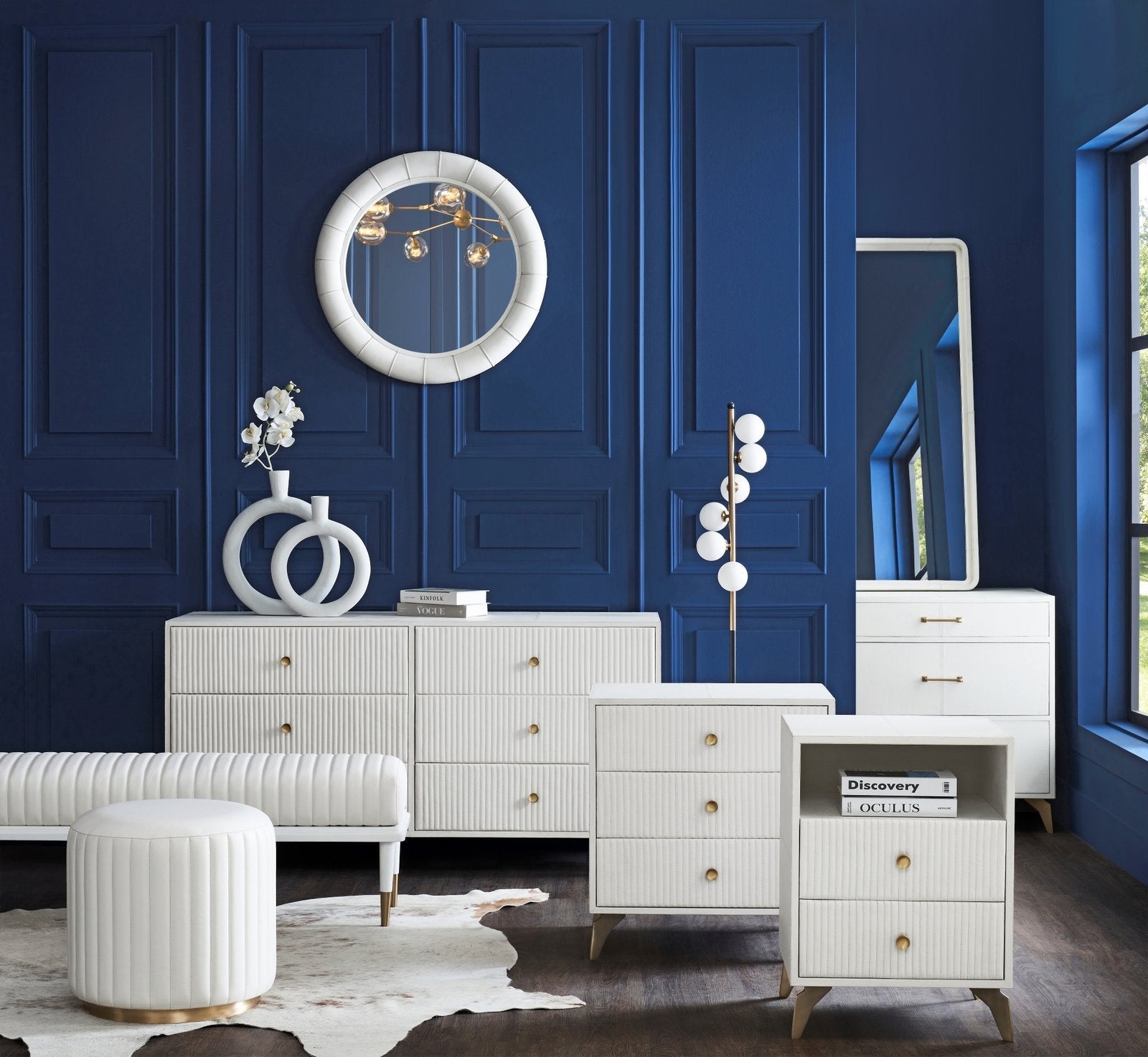 FN-5202-X-4_2|Stylish round decorative mirror with a ribbed white frame, a focal point in this contemporary blue bedroom setting.