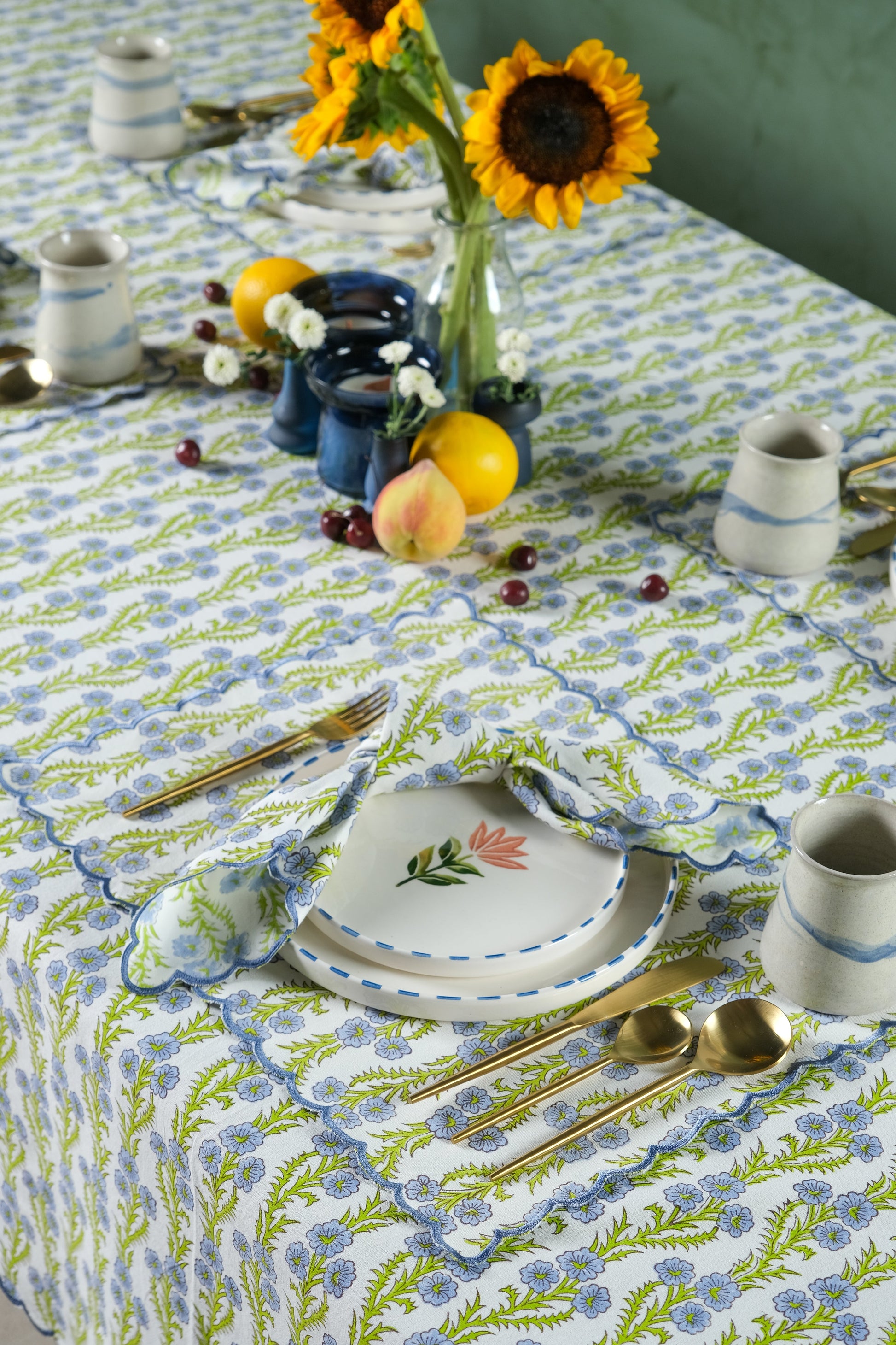 Forget-Me-Not scallop embroidered blockprint placemat in joyful table setting