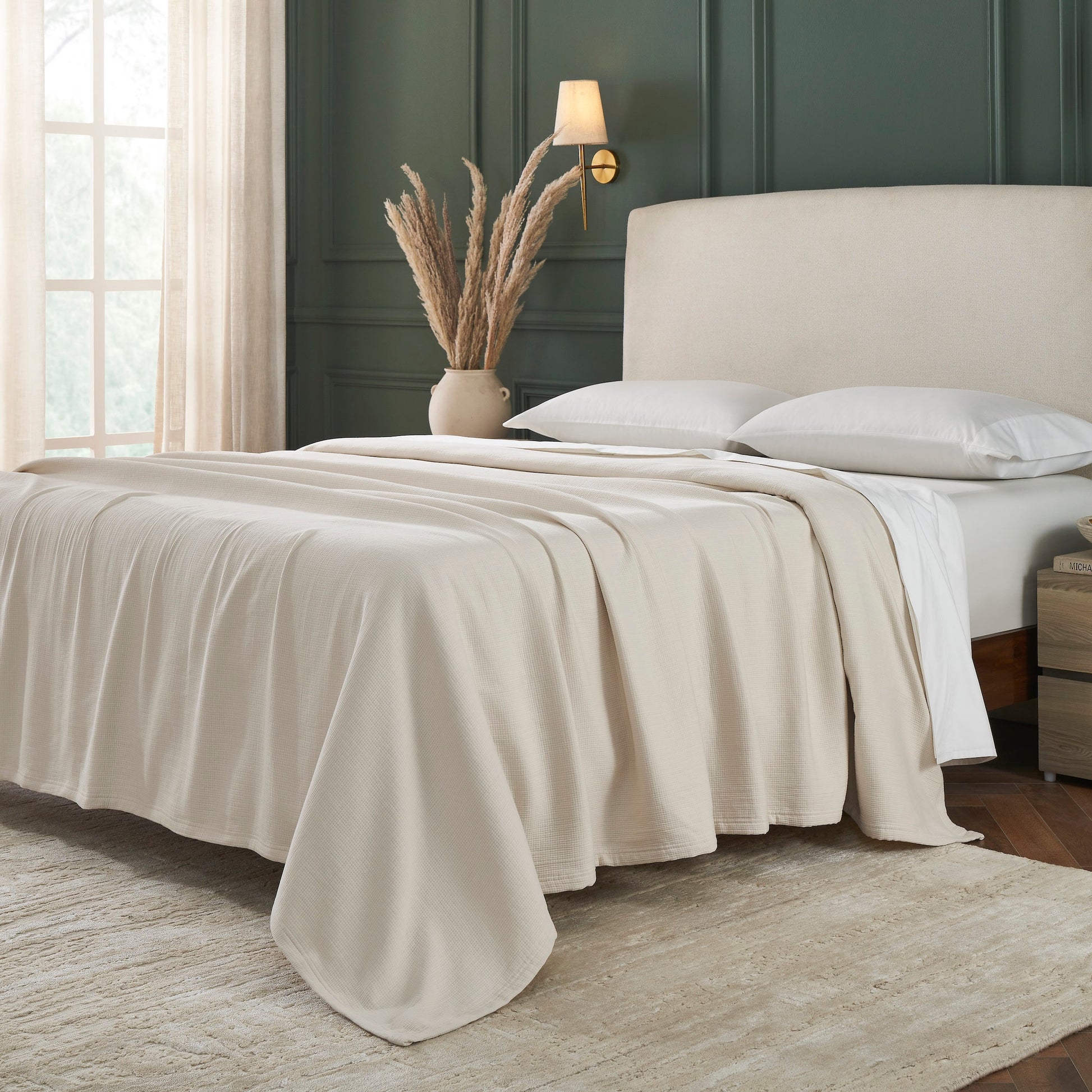 BL-860-9496_2|Cozy cream waffle weave blanket draped over a bed, enhancing a comfortable and stylish bedroom with soft texture.