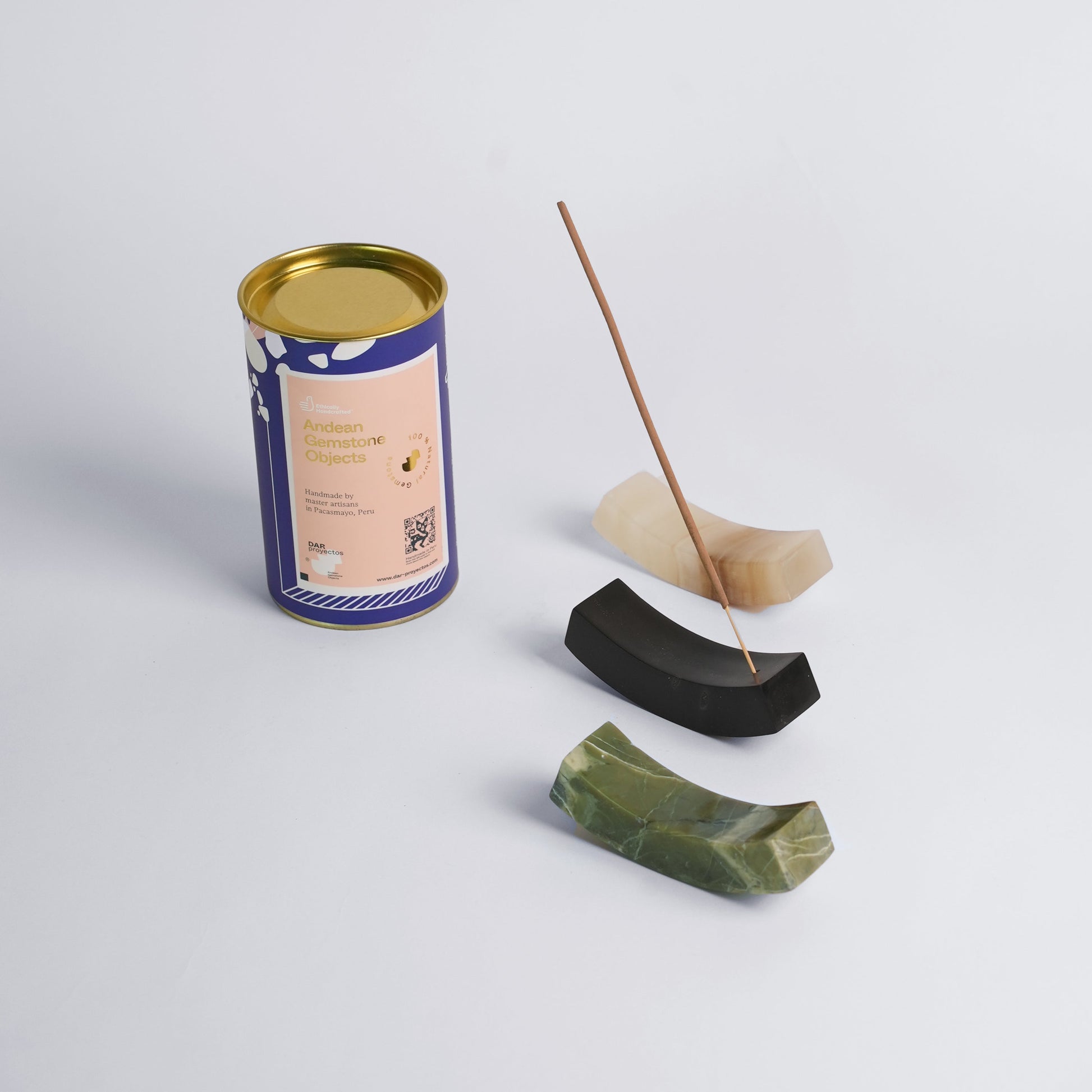 Group display of curved gemstone incense holders highlighting the quiet luxury of Andean materiality.