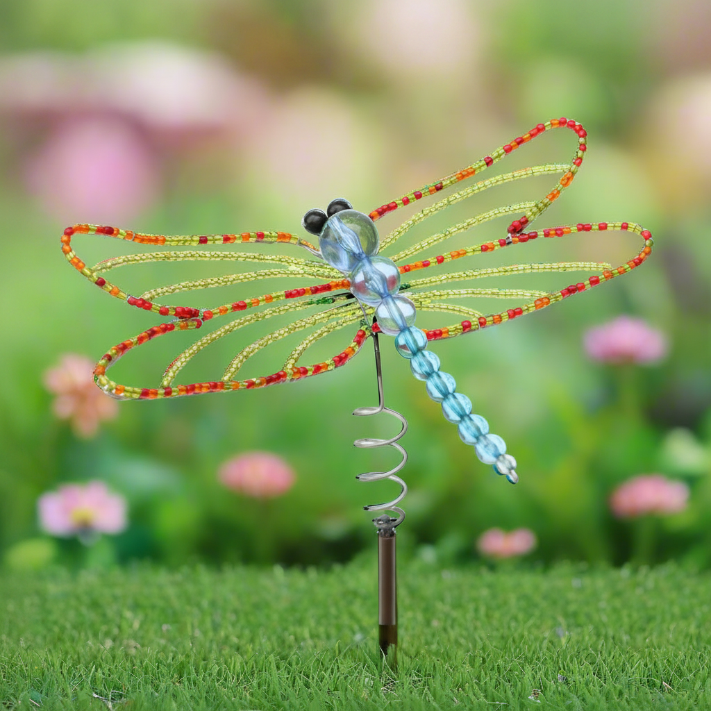 Close-up detail of hand-sculpted beaded dragonfly garden stake artisan craftsmanship