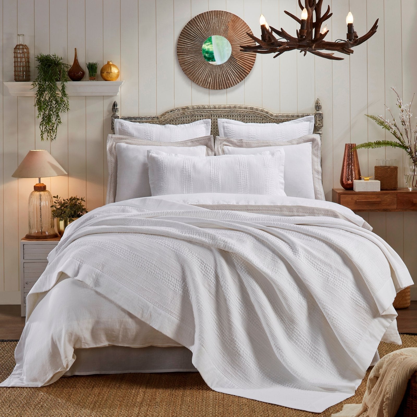 CL-163-DUP-X_1|White textured coverlet draping elegantly over a bed, offering a fresh and clean layer for a serene, inviting bedroom aesthetic.