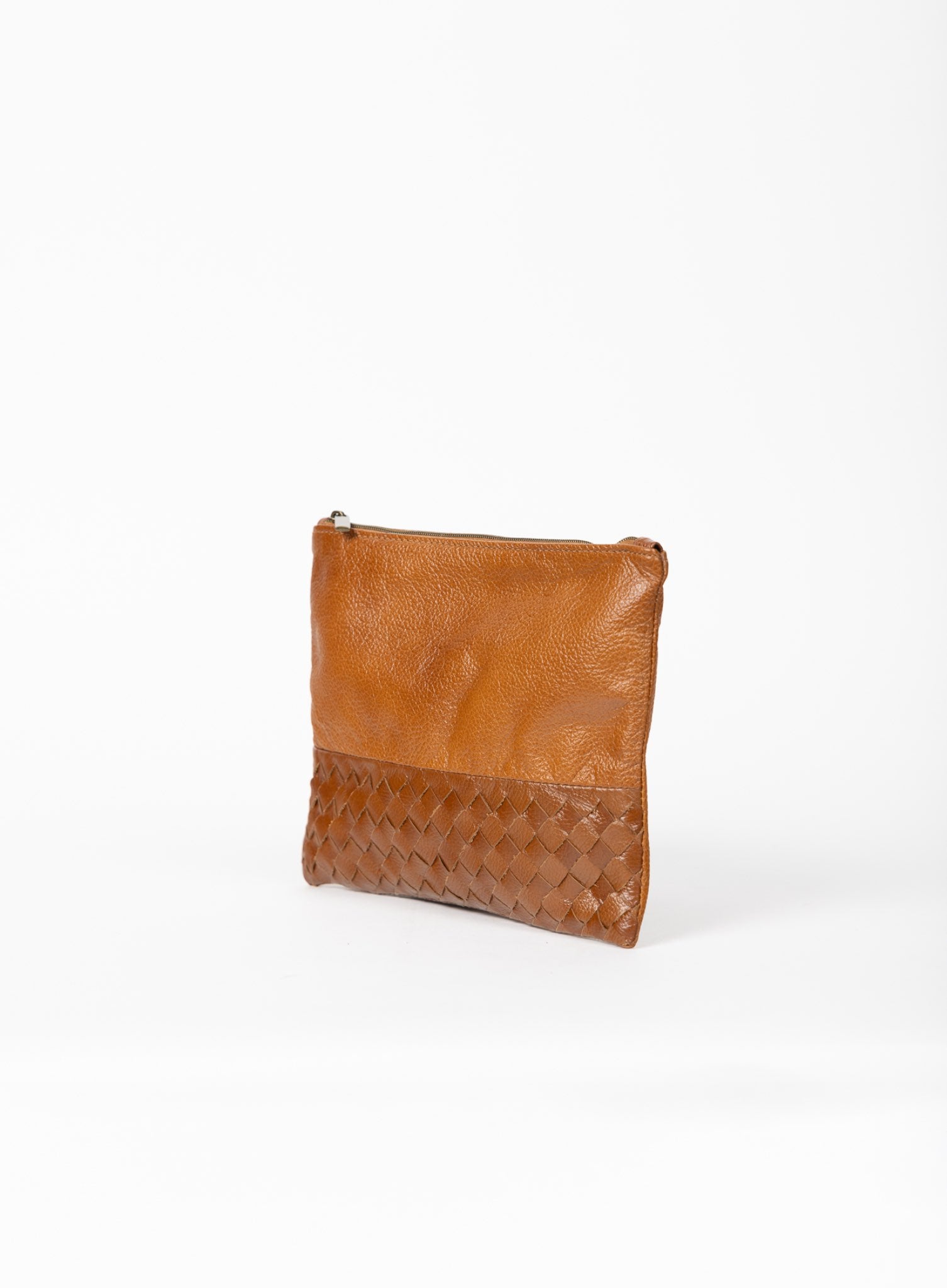  large pouch from ethically crafted accessories in cognac showcasing side view.