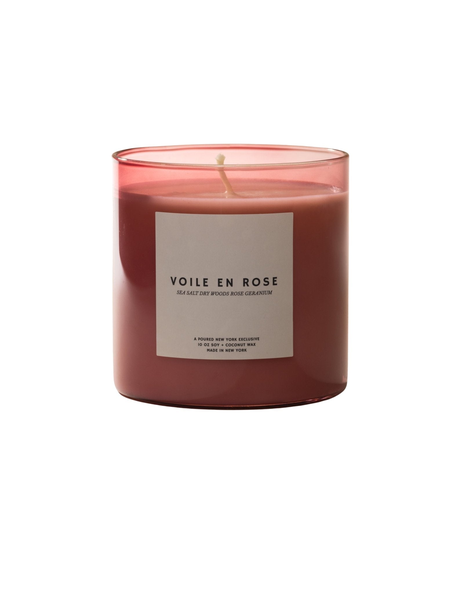 Poured New York 'Voile en Rose' pink glass candle with white label and matching box with rose decal on neutral background.