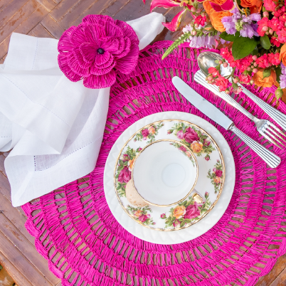 Buriti straw placemat handwoven from natural Brazilian palm fiber in pink by Talah Home