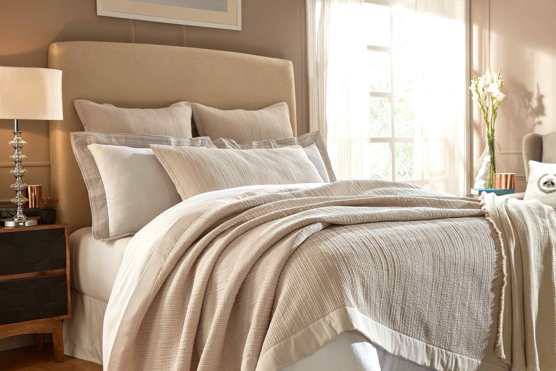 CL-161-9496-LOT1_2|Natural beige textured coverlet elegantly draped on a bed, creating a warm, inviting layer for a sophisticated bedroom setting.