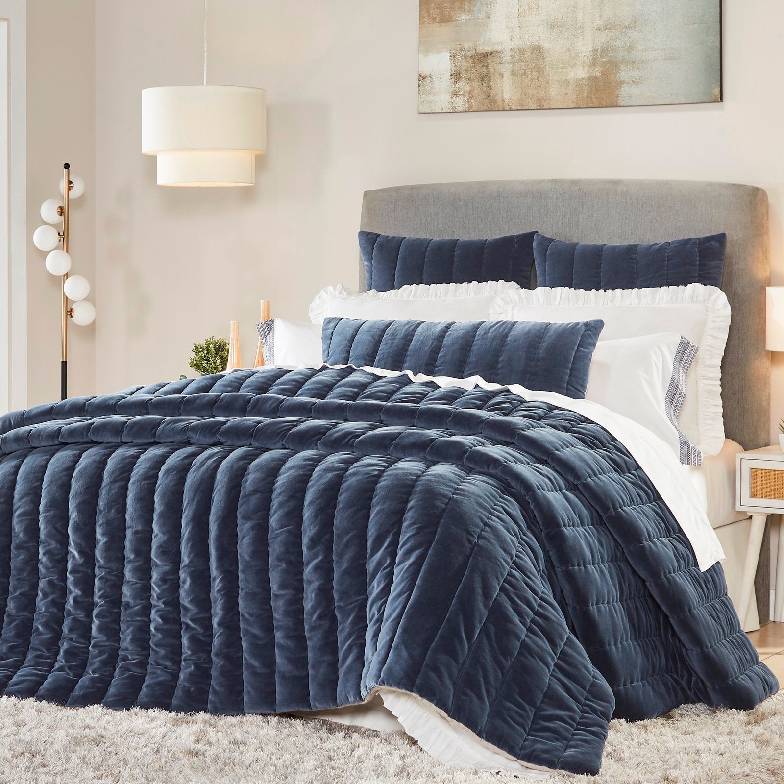 QT-335-11096_1|Elegant navy velvet quilt with channel stitching drapes over a bed. Luxurious texture and rich color enhance bedroom decor.
