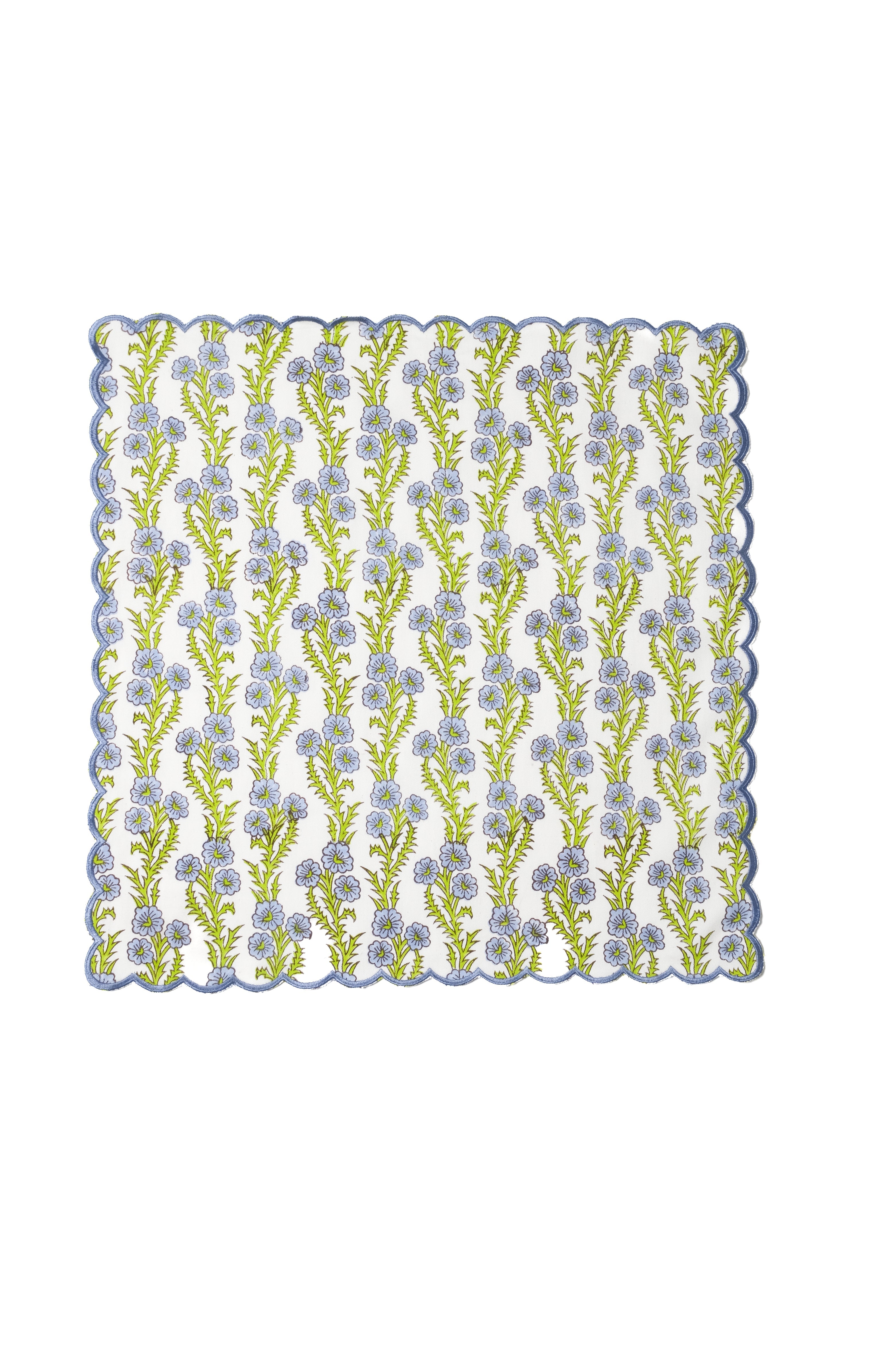 Forget-me-not scallop embroidered napkin with blue flowers and green stems on white fabric from Inner Child