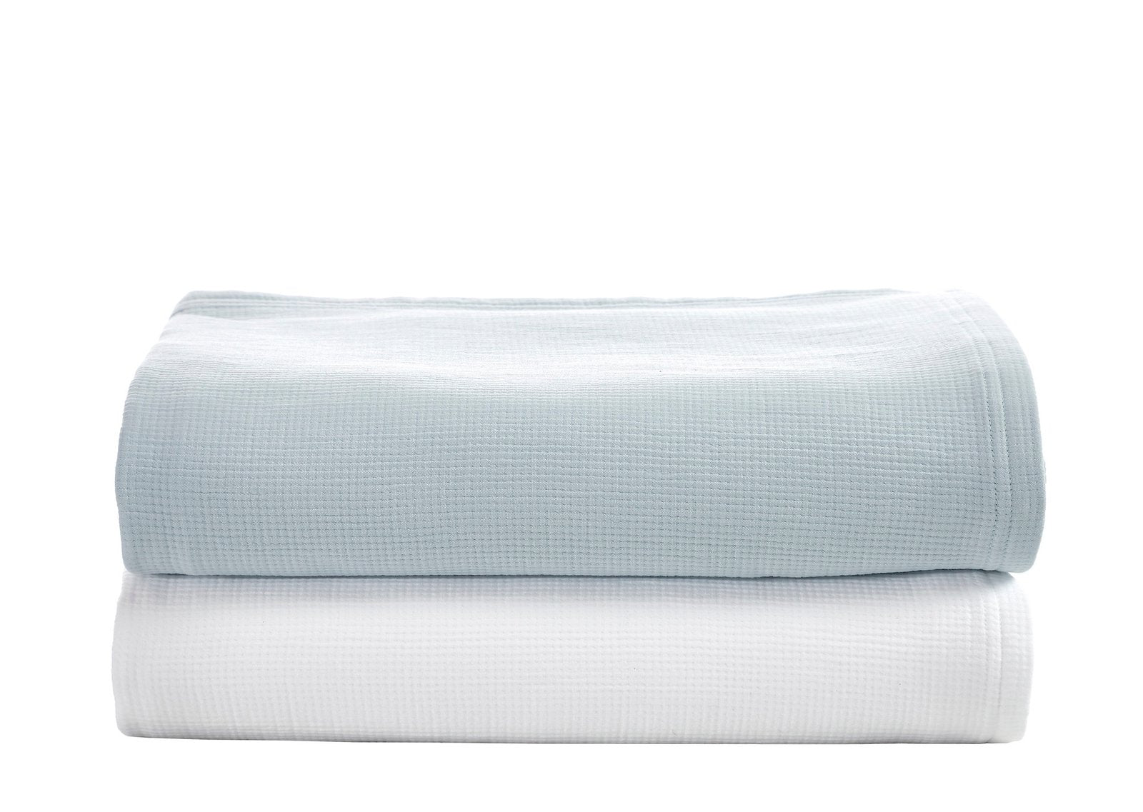 CL-259-11096_4|Stack of two soft waffle weave coverlets, one in light blue and one in crisp white, inviting texture.