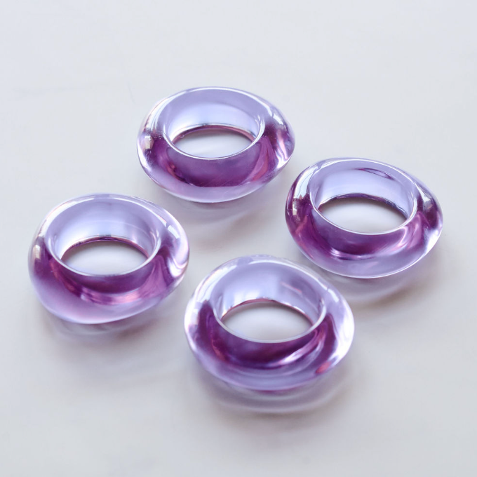 Lavender glass napkin rings close up showing hand-cast organic shape and texture detail - Goldie Home