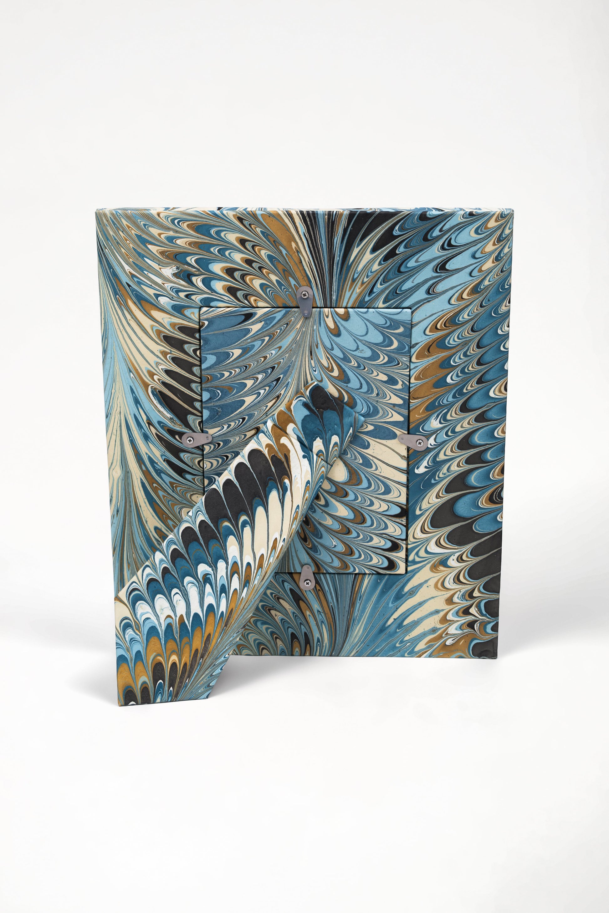 Back view of hand-marbled standing picture frame with metal hardware, Inner Child design