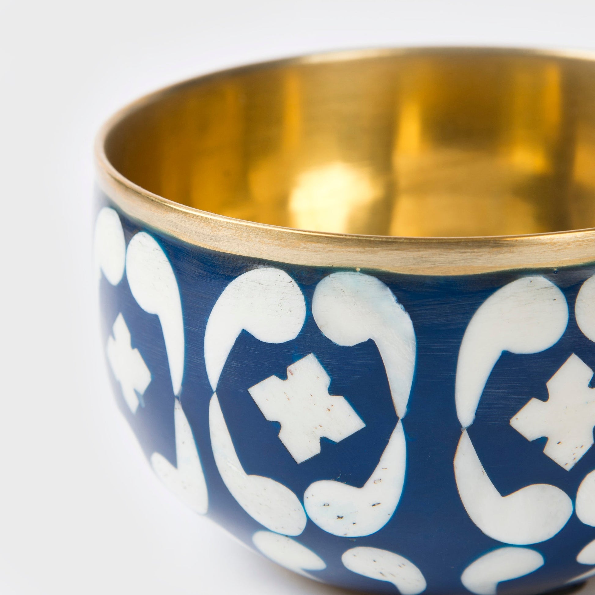 Close-up of blue lattice pattern and handcrafted finish on trinket bowl and tray