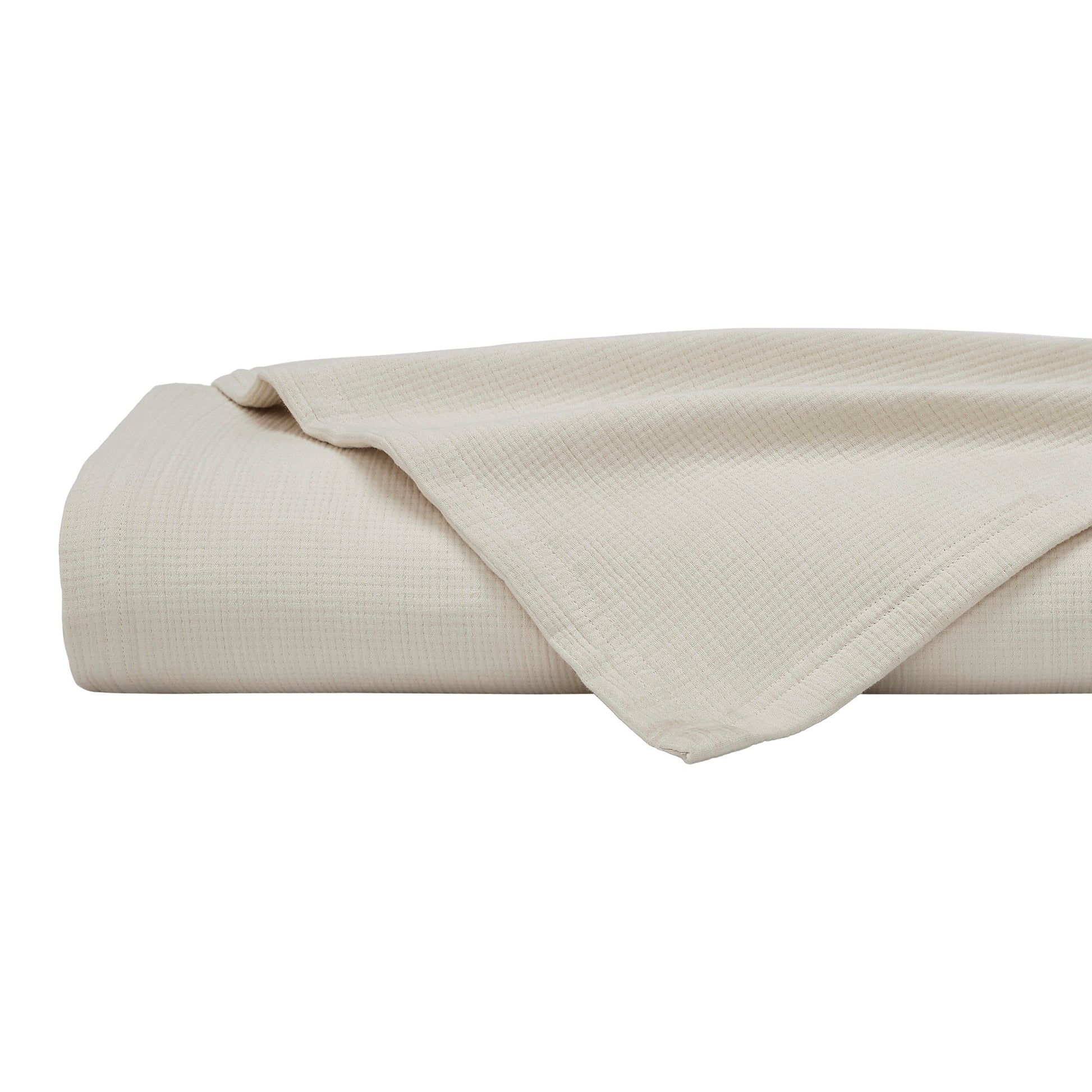 BL-860-11096_6|Neatly folded cream waffle weave blanket, perfect for adding cozy texture and warmth to any living space. Soft and inviting.