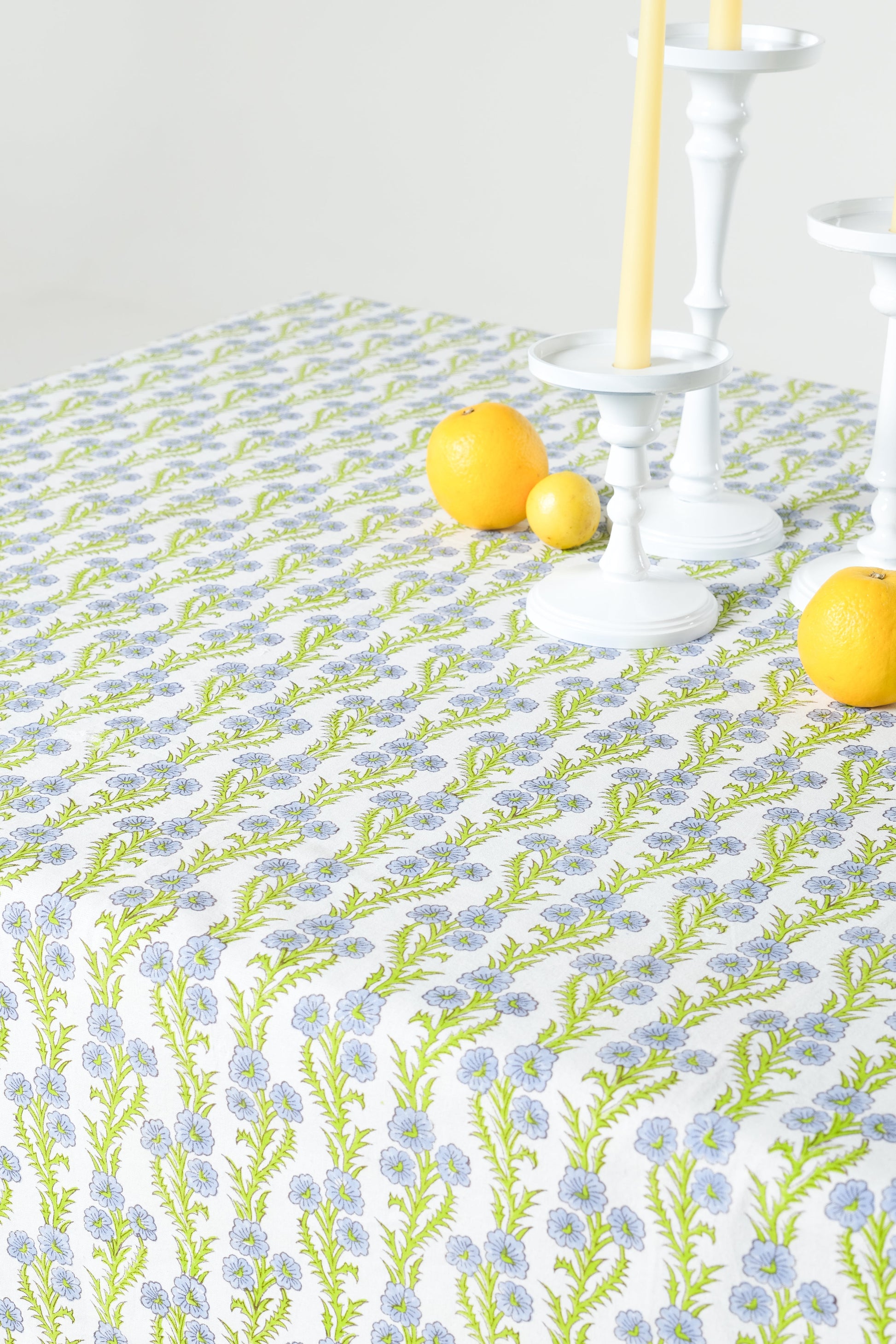 Forget-Me-Not scallop embroidered blockprint tablecloth with citrus fruits and candlesticks