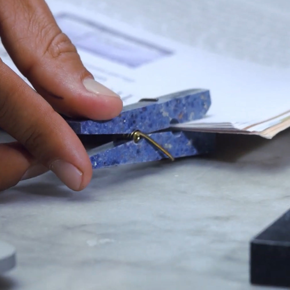 Dumortierite blue gemstone laundry clip acting as an elegant functional accessory in a sophisticated setting.