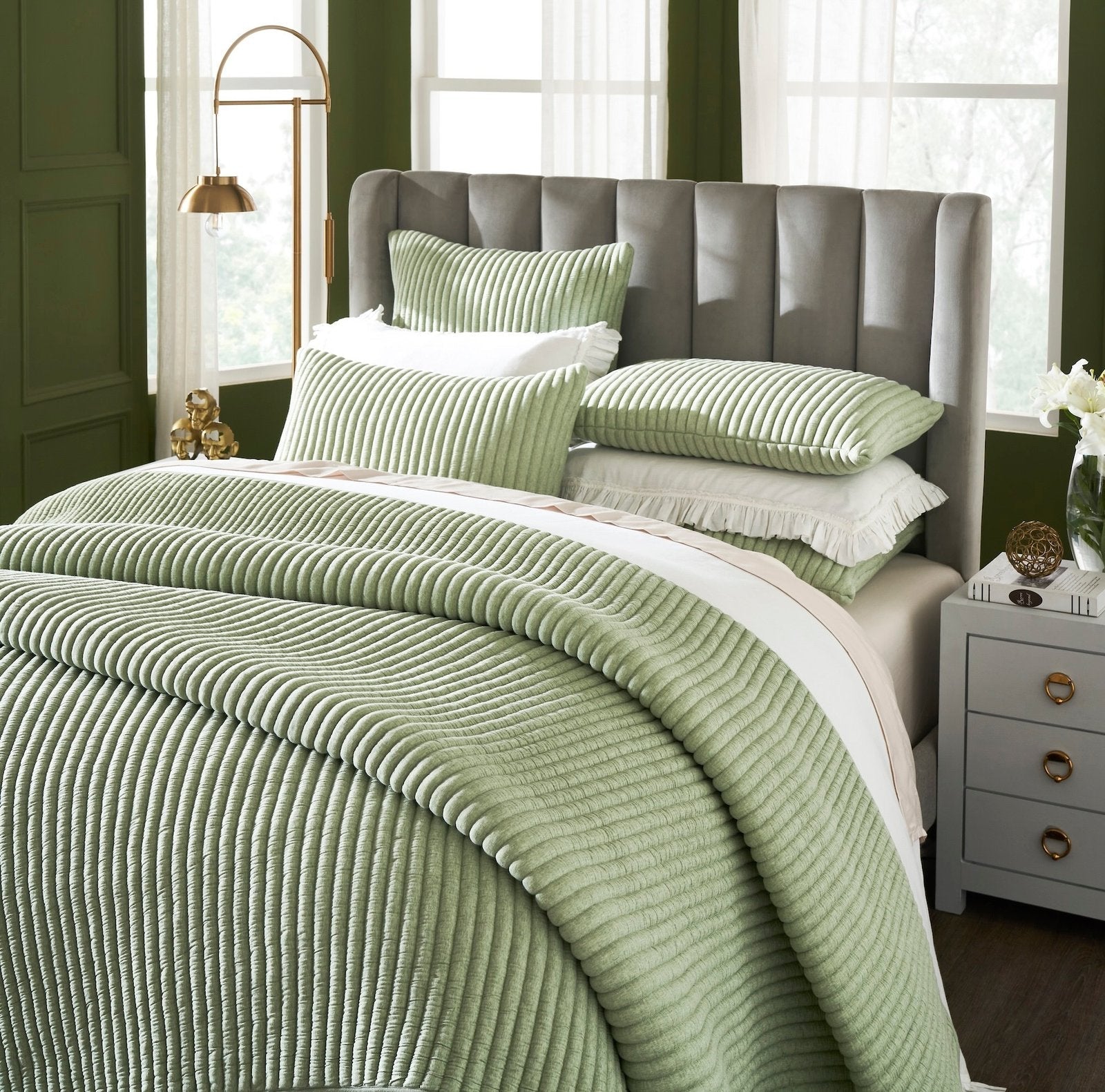 QT-370-11096_3|Close-up of a soft sage green corduroy ribbed quilt, showcasing its plush texture and cozy, inviting design.