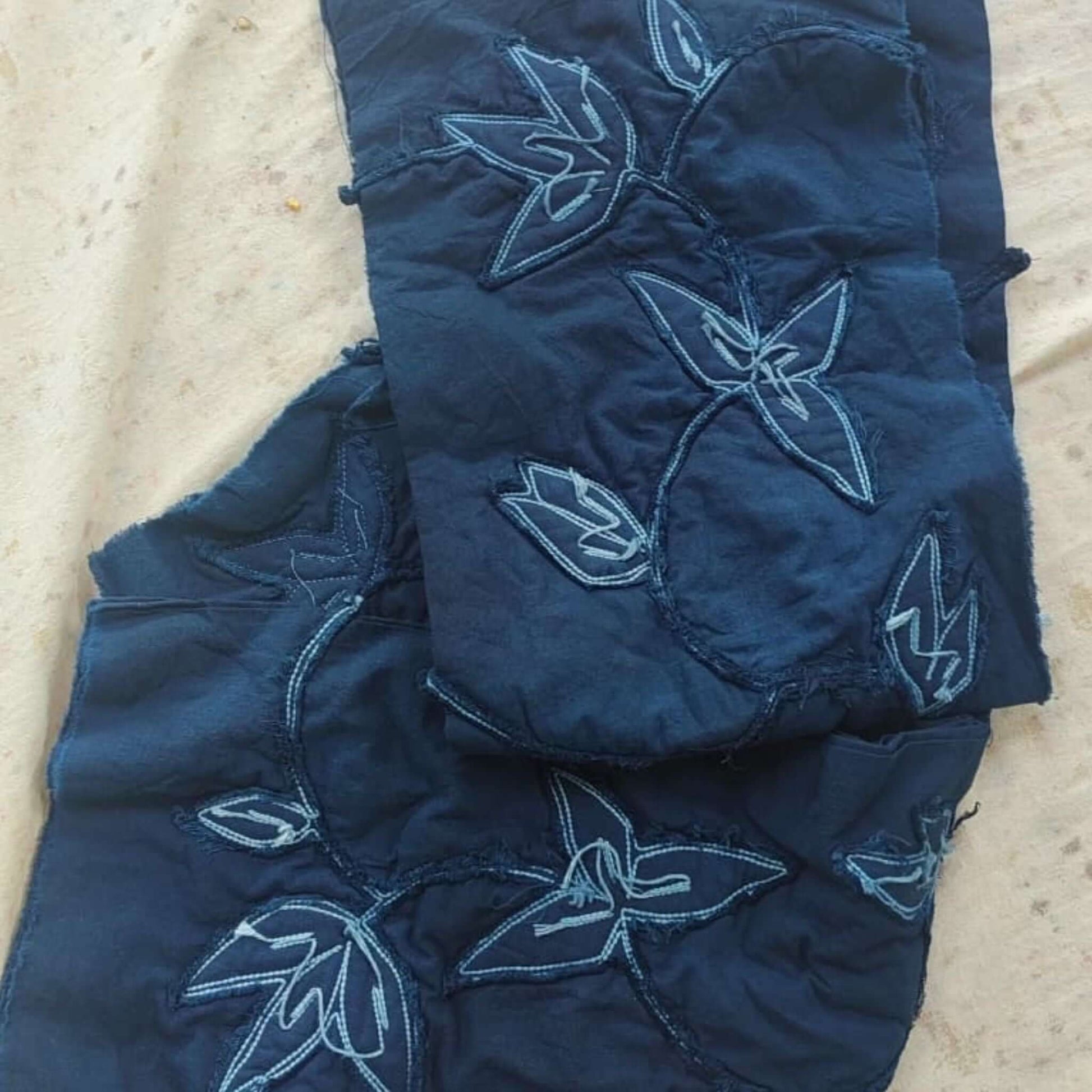 Folio Indigo Handcrafted Shibori Cotton Table Napkins ( set of 4 ) featuring intricate floral design on deep blue background.