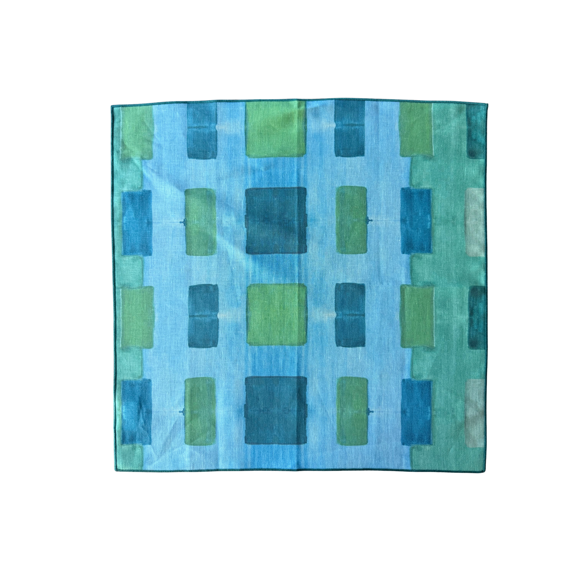 Blue Tapestry linen dinner napkin close up of turquoise and seafoam color palette - Goldie Home