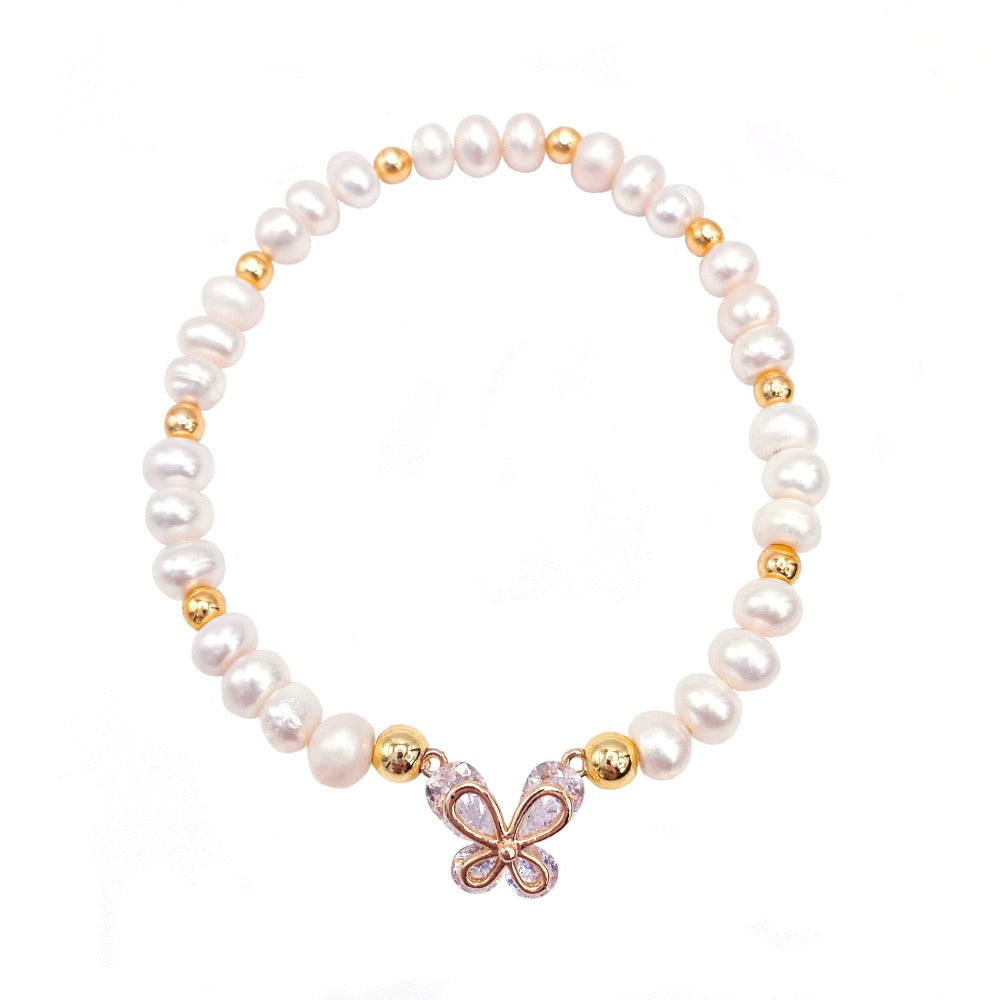 Pearl gold butterfly bracelet modeled