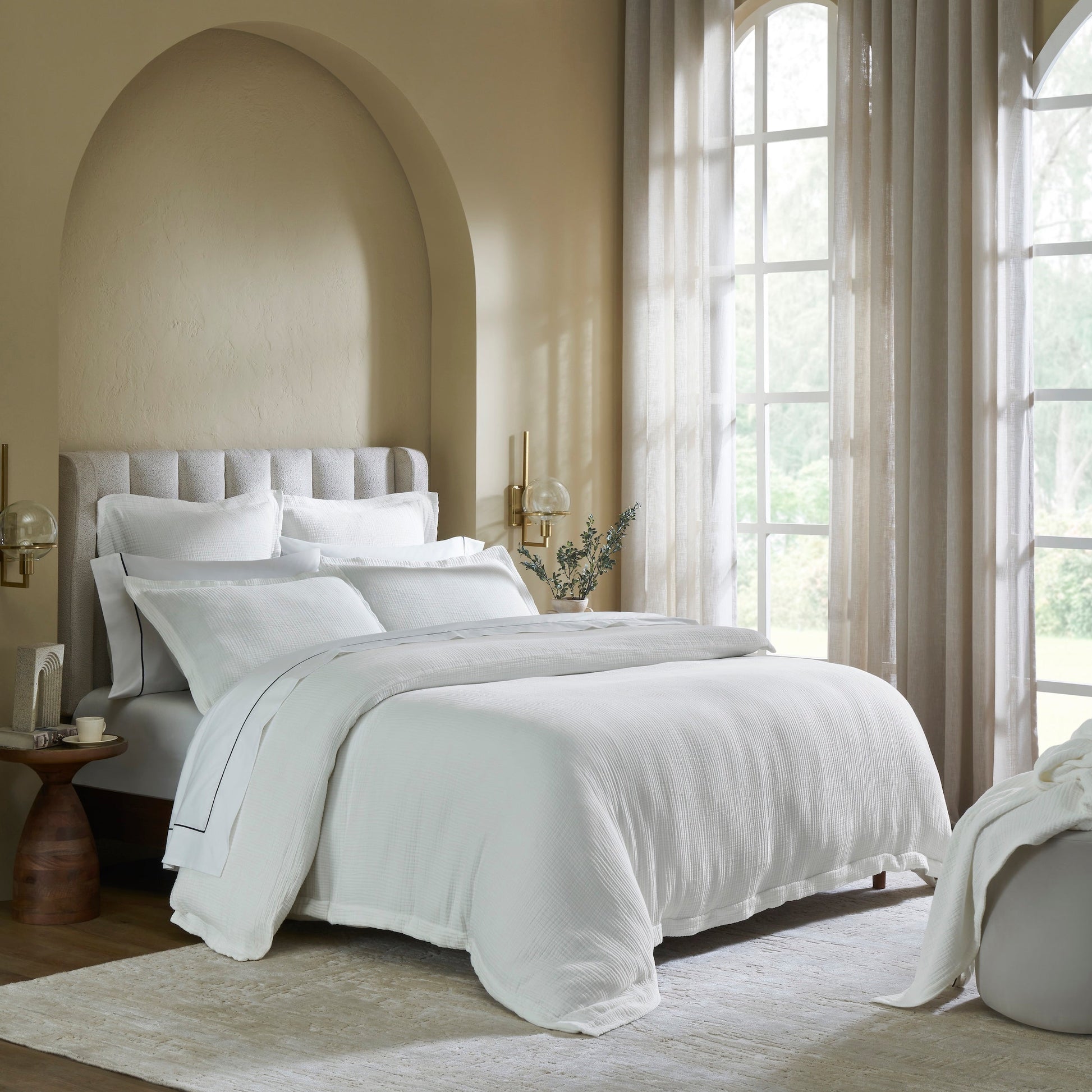 DT-048-9092_2|Elegant white textured duvet cover gracing a stylish bed in a bright bedroom, adding a luxurious and comfortable layer.