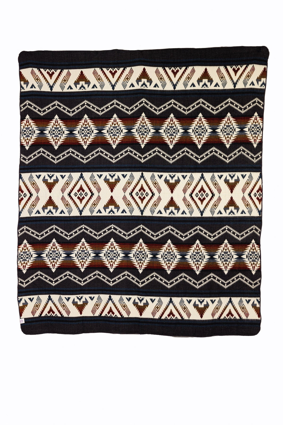 A woven throw blanket featuring a geometric pattern with shades of brown and dark red.