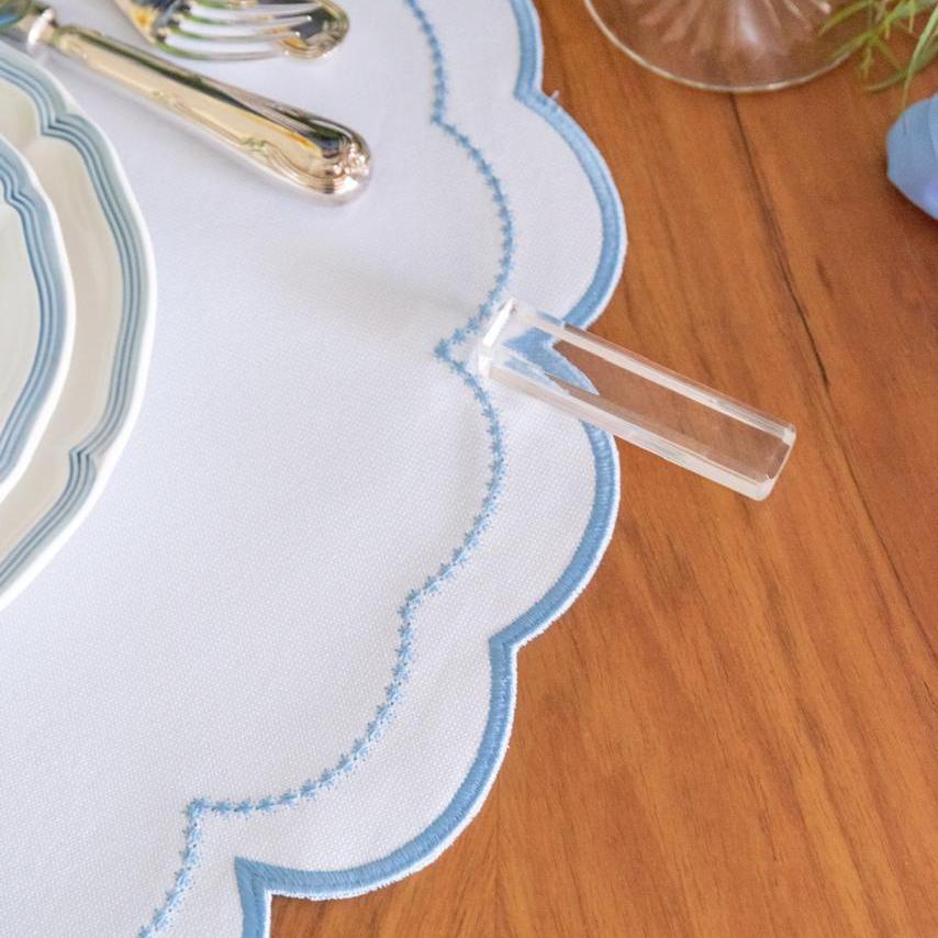 The blue Victoria impermeable placemat with Victorian-style border detail by Talah Home
