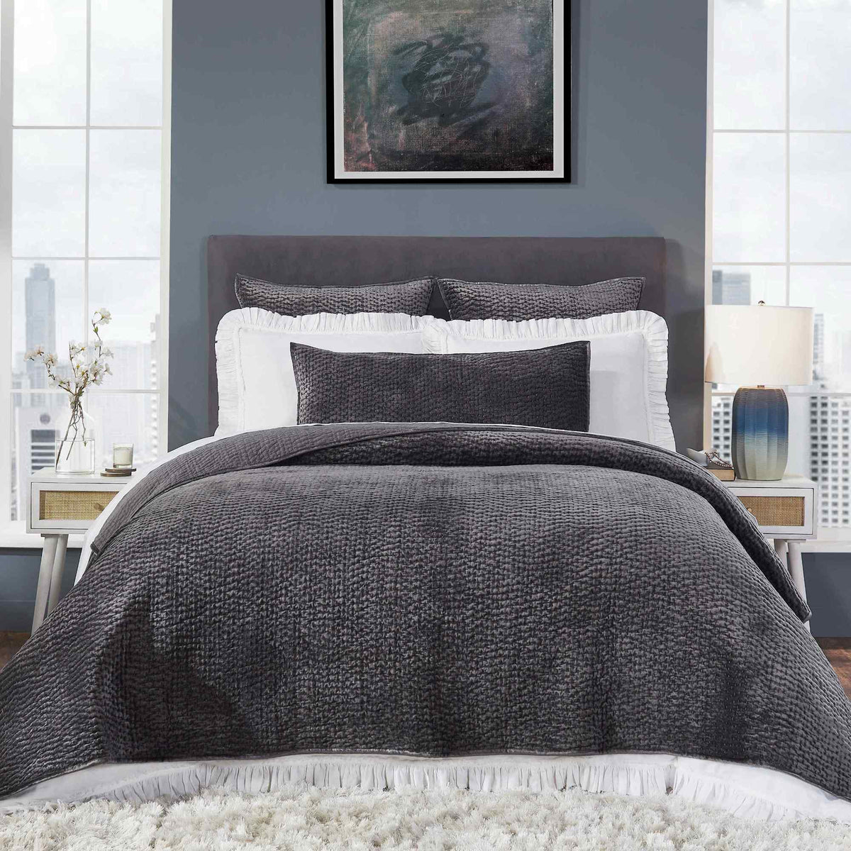 CL-195-9496_2|Luxurious navy blue quilted coverlet draping a bed with matching pillows, adding elegance and comfort to the master bedroom.