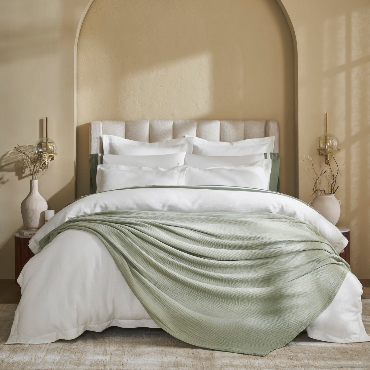 BL-864-9496_1|Stylish bedroom featuring a light green textured blanket draped over white bedding, adding cozy comfort and modern elegance.