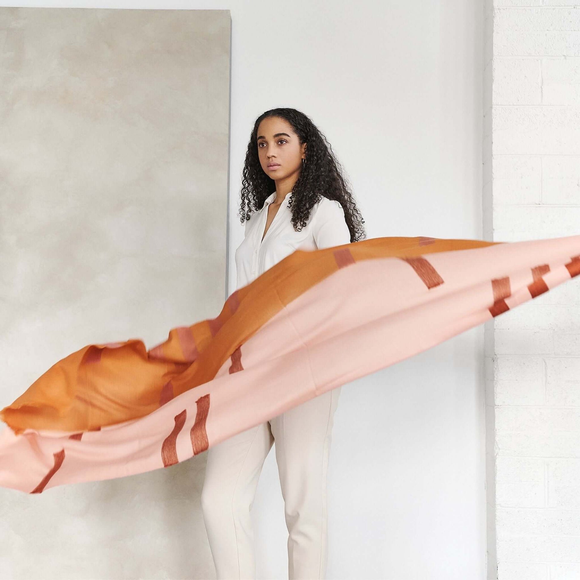 Canyon Hand Embroidered Hand Woven Merino Silk Soft Scarf displayed elegantly by a model in a minimalist setting.