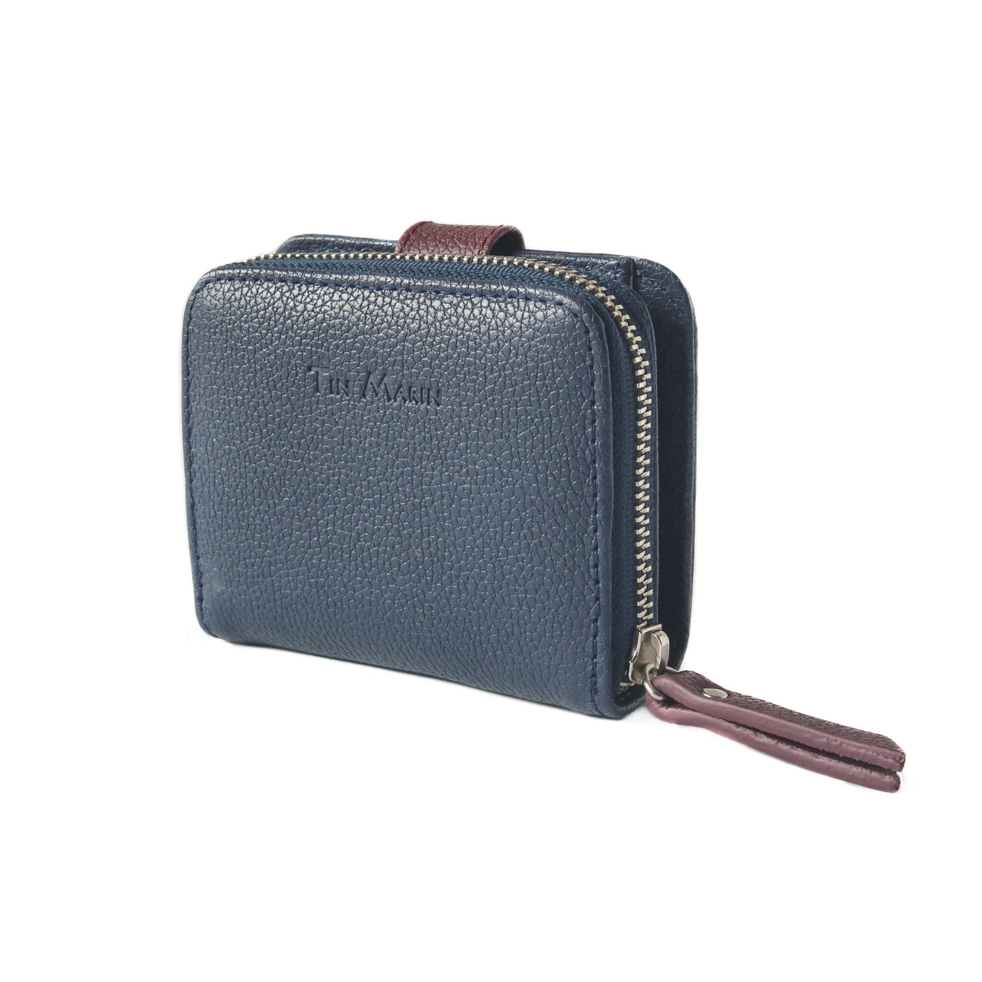 Embossed Tin Marin logo and signet detail on closure flap