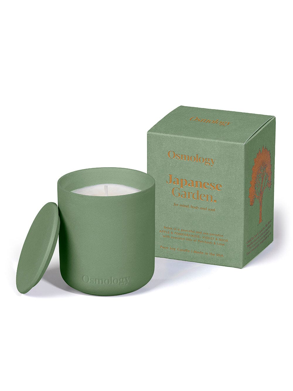 Green Japanese Garden candle by Osmology displayed next to product packaging on cream background 
