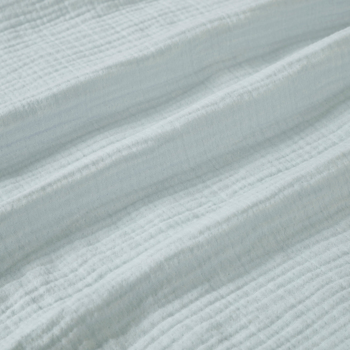 BL-863-9496_9|Close-up of soft light blue gauze blanket texture, breathable cotton weave, perfect for airy bedding and cozy comfort.