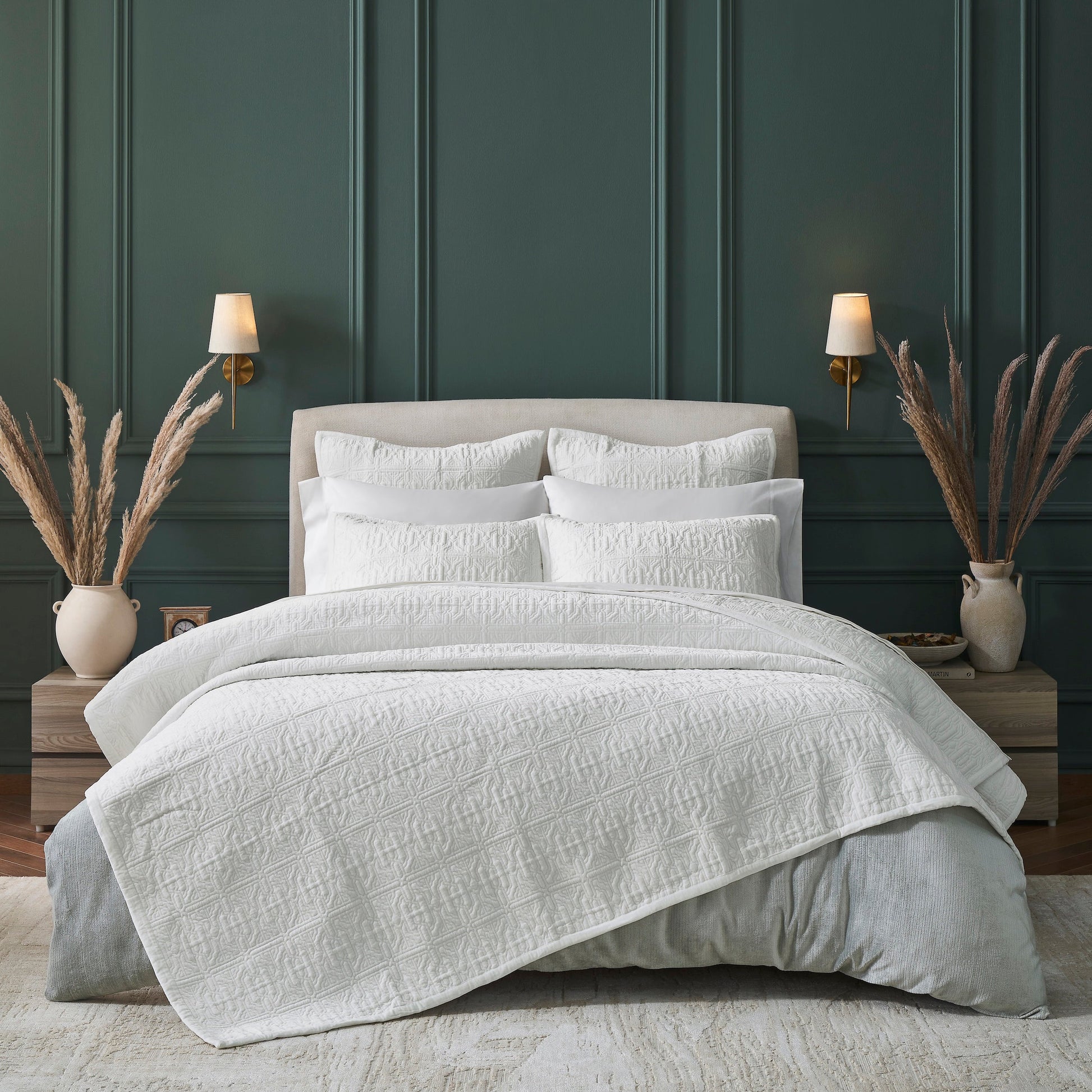 QT-376-11096_1|Elegant white patterned quilt set, featuring intricate textured design over a grey duvet, perfect for modern bedroom styling.