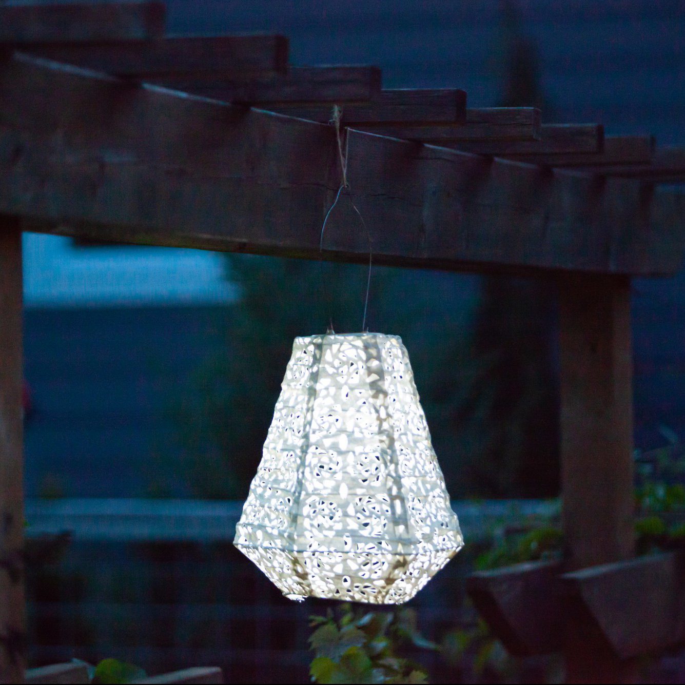 Soji Stella Prism Tyvek Solar Lantern glowing at night