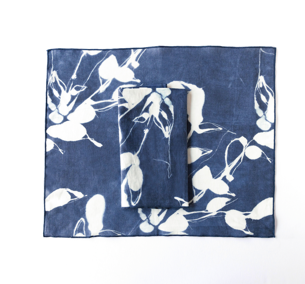 Porto Print Indigo linen placemat styled on dining table - Goldie Home