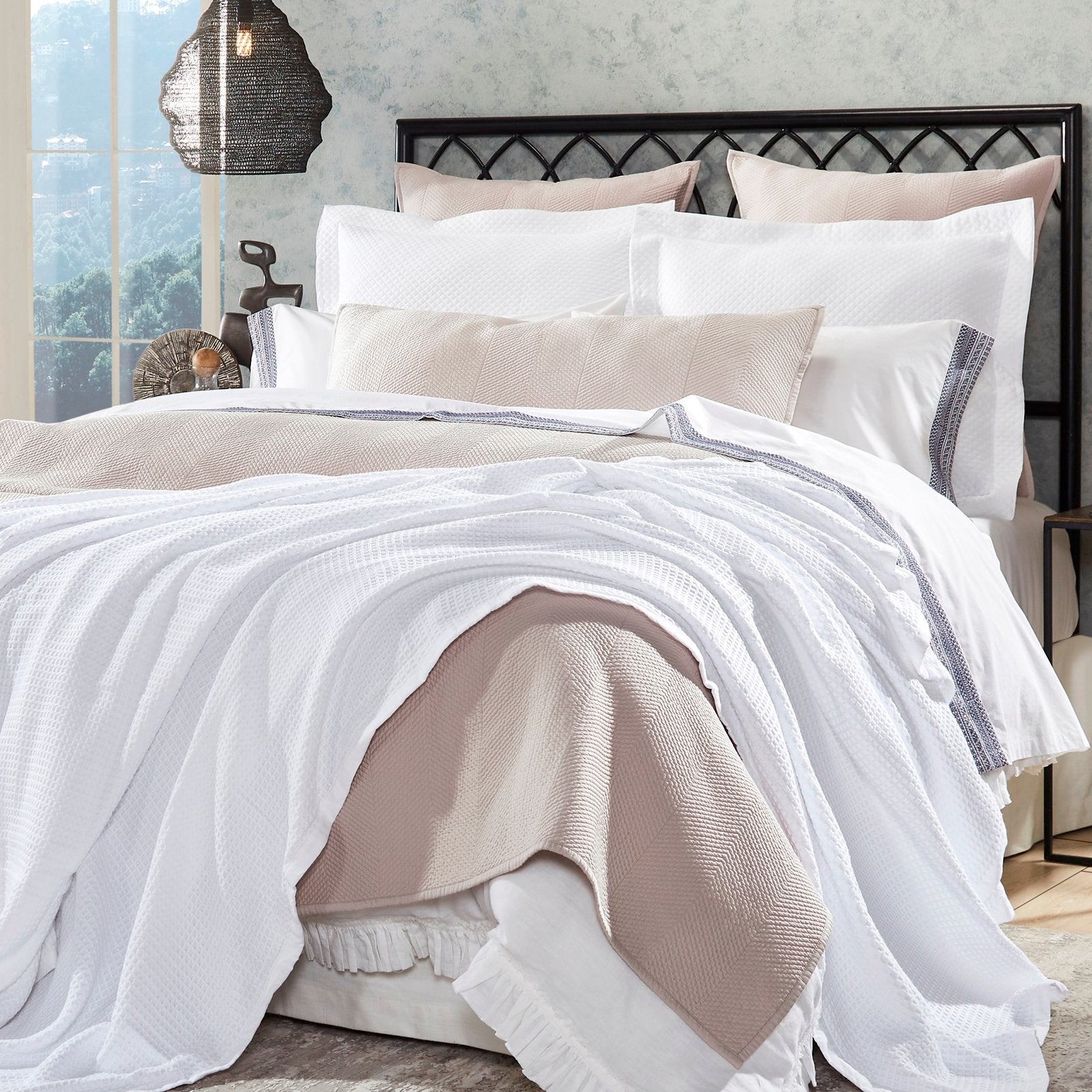 BL-855-X_1|Crisp white waffle weave blanket elegantly draped over a bed, adding clean texture and inviting comfort to modern bedroom decor.