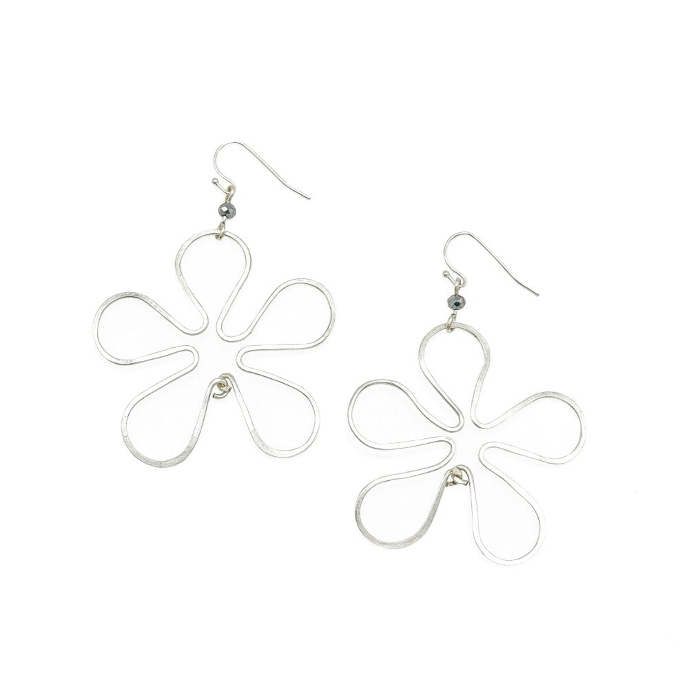 Large silver flower earrings modeled